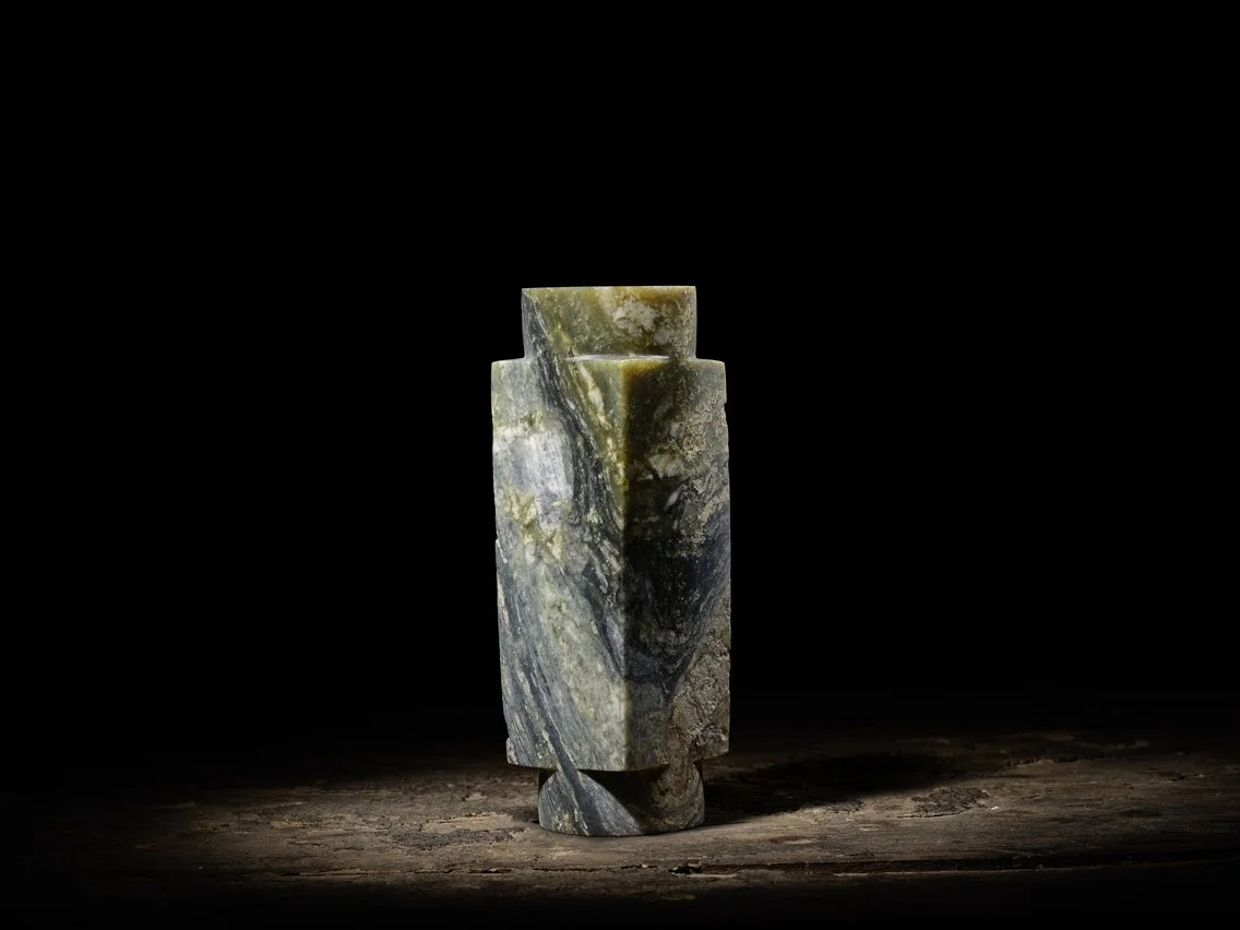 A mottled sea-green, grey and cream jade cong, China, Qijia Culture (2200–1600 BCE)