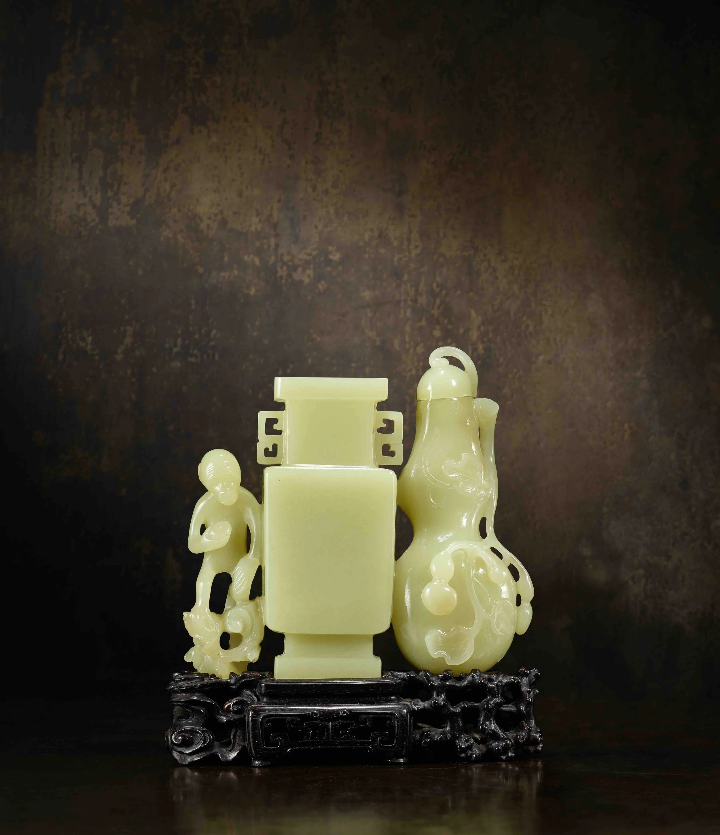 An imperial yellow jade vase group, 
China: Qianlong period (1736-95), original fitted zitan stand carved with pierced branches and cloud-scrolls