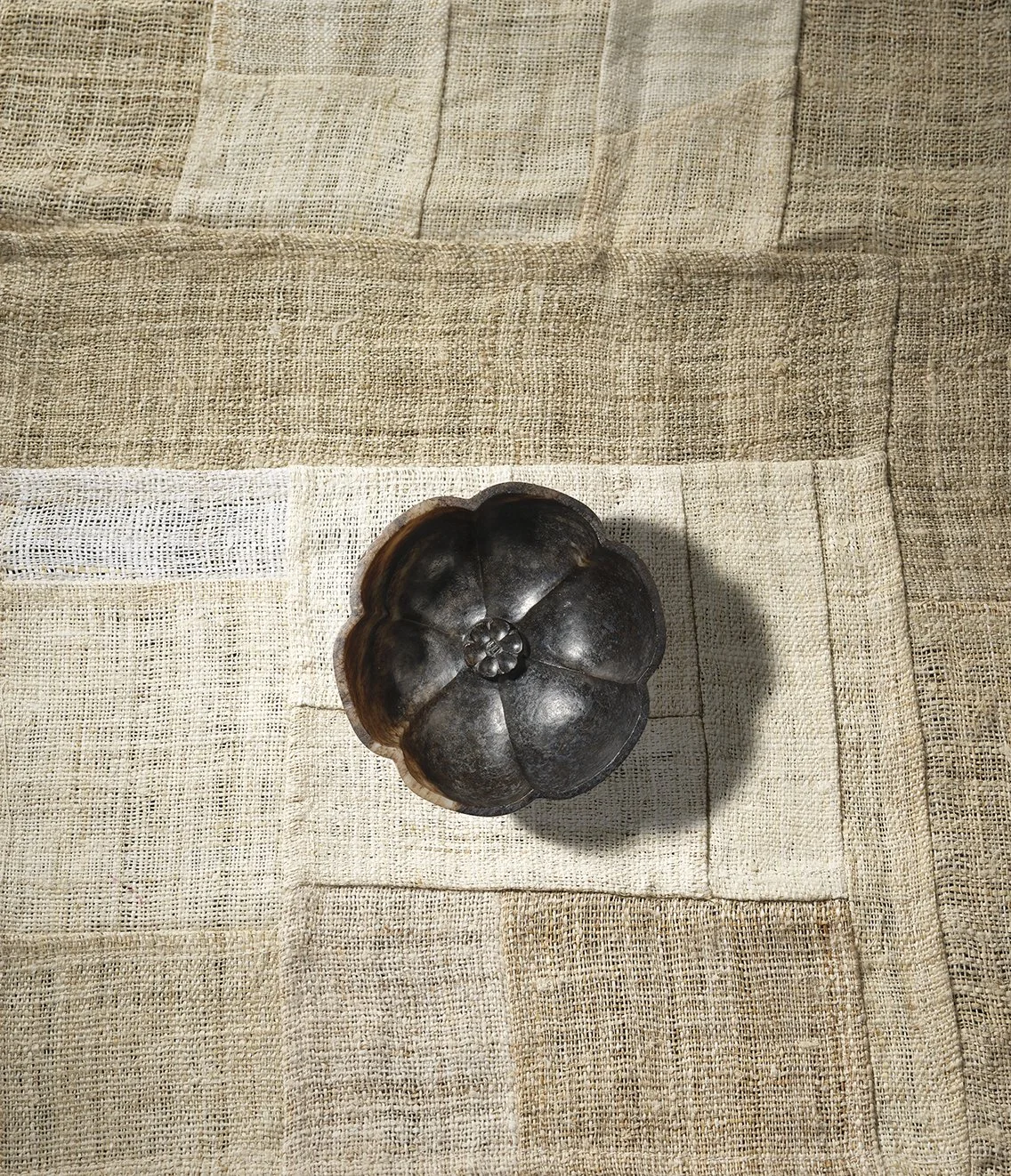 A mottled dark and light grey jade hexafoil flower cup, China, Song dynasty (960–1279)