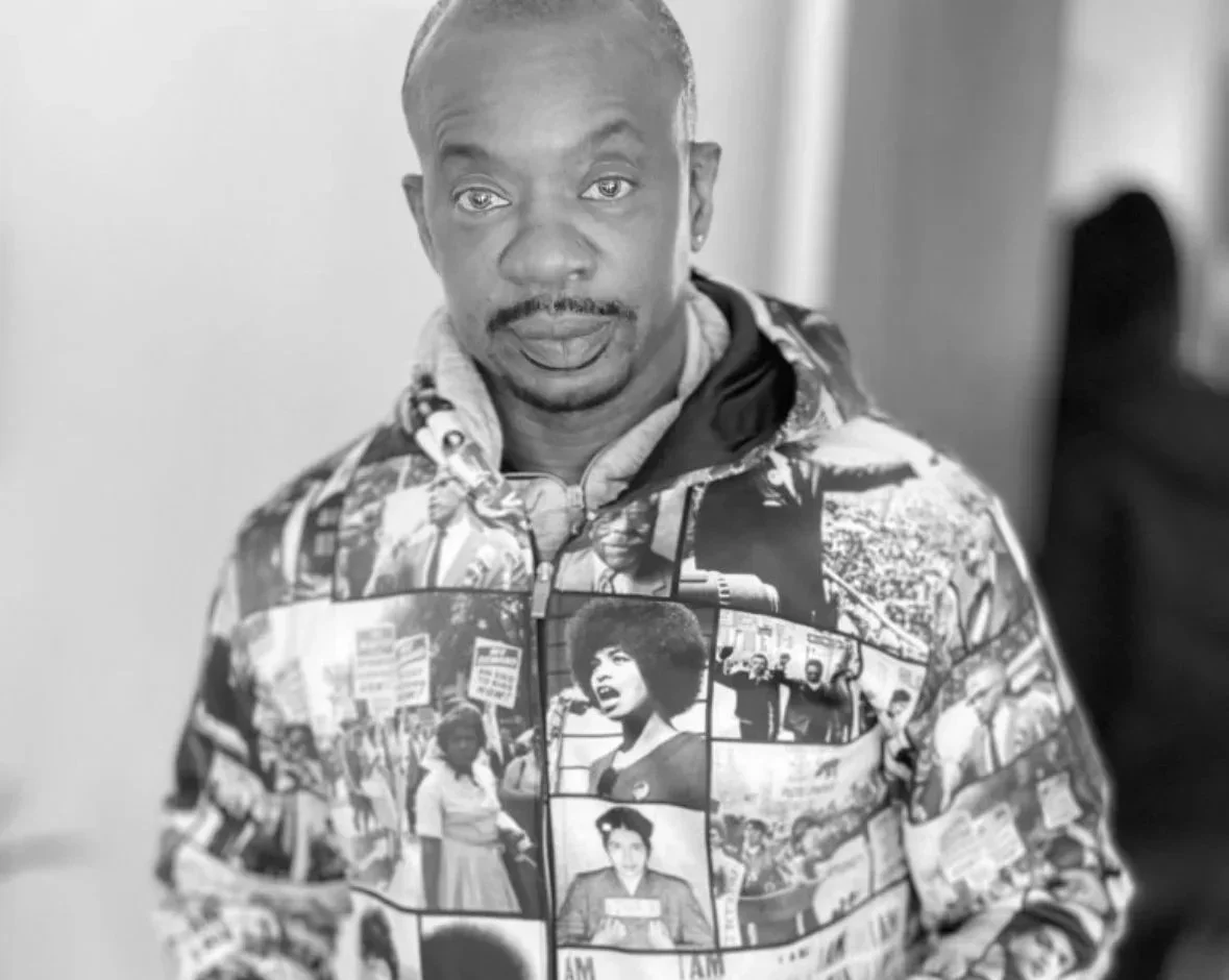 black and white photo of a man wearing a jacket with man photos.