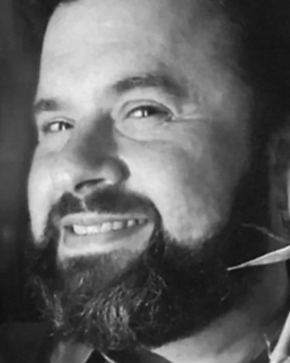Black and White Photo of a man with a beard.