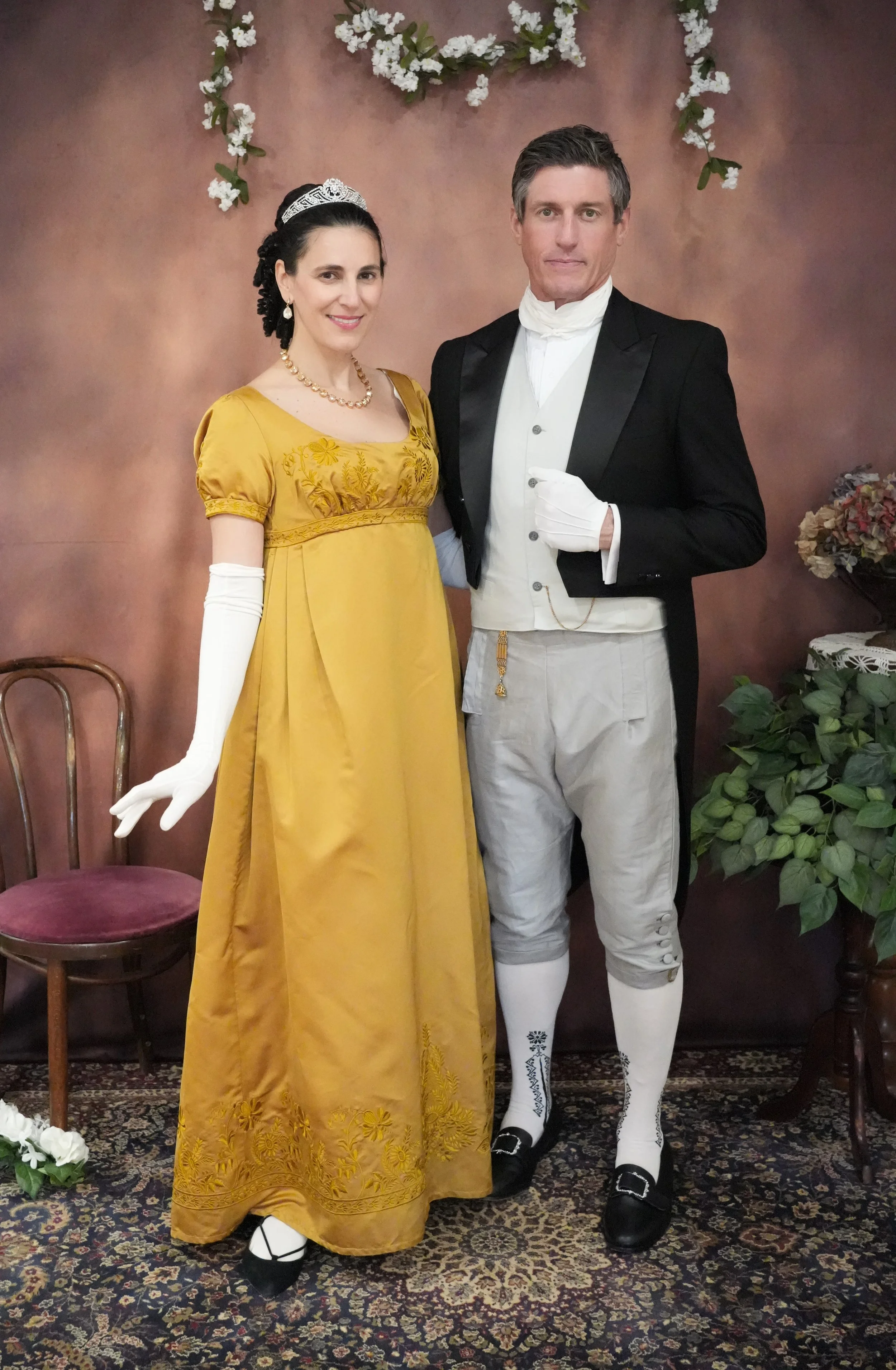 A couple wearing Lewis and Clark or Regency era costumes to a Ball.