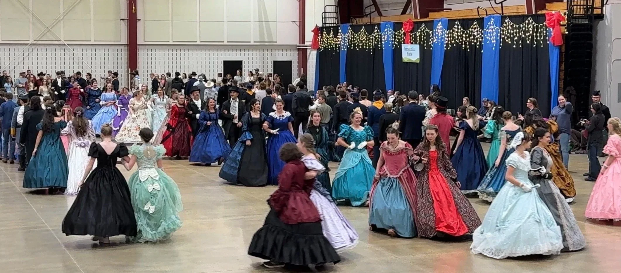 Students dressed in Civil War ball gowns and formal attire for a Victorian Civil War Reconciliation Ball by You Can Live History.