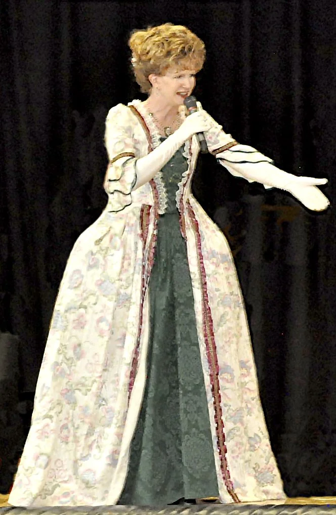 Sharon Guli, in historic Colonial costume, leading a Revolutionary War era Ball.