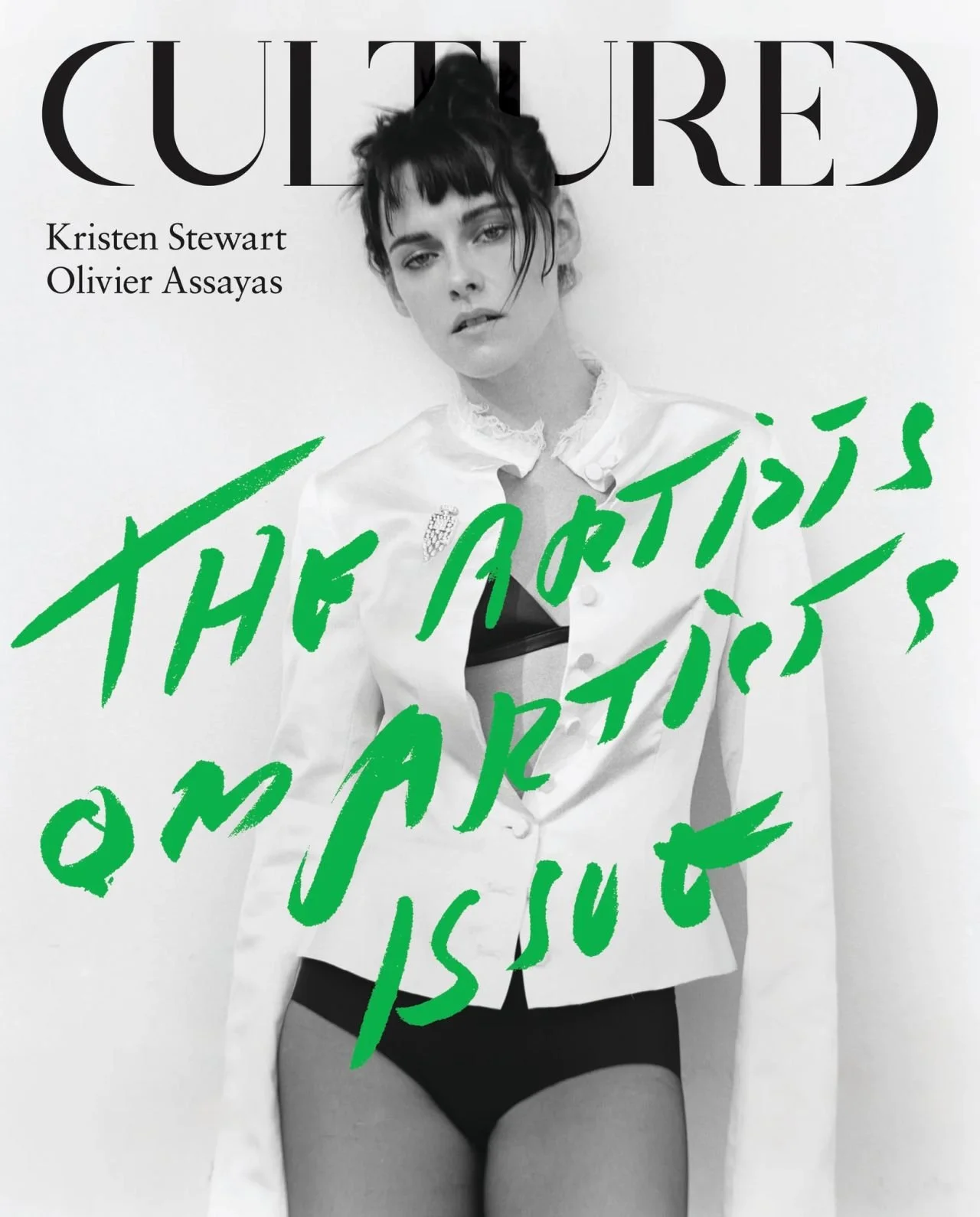 Black and white magazine cover featuring a model in lingerie and a shirt, with green handwritten text overlay reading 'THE ARTISTS ON ARTIST'.