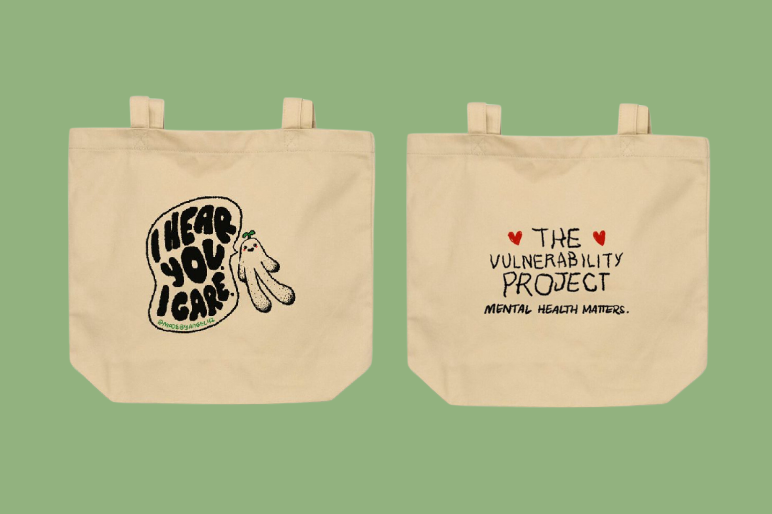 Two beige tote bags with black and colorful print, one with a message 'I hear you, I care!' and a small cartoon character, the other with the text 'The vulnerability project, mental health matters' and red heart accents, set against a light green background.