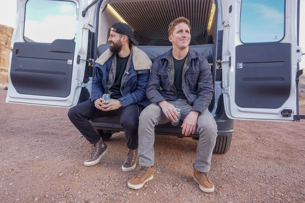 Hunker Founders, Jon Moran and Dillon Hansen sitting on a campervan.