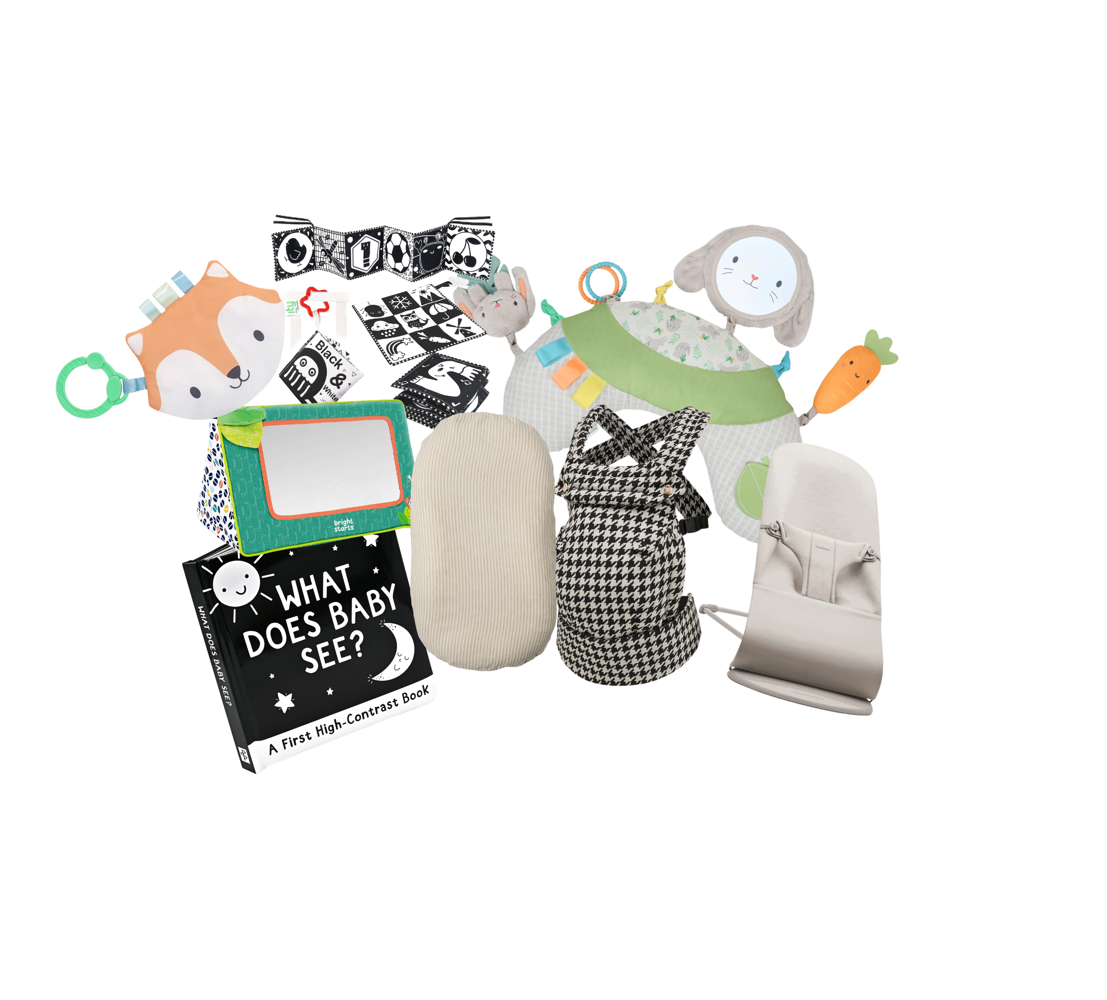 Collection of children's toys including a plush fox, a teaching clock, a soft bunny toy with a mirror on its head, a shape sorter with a carrot and a white plush elephant, a black-and-white board book titled 'What Does Baby See?', a fabric cube, a black-and-white cloth book, a giraffe-shaped soft book, and various small items.