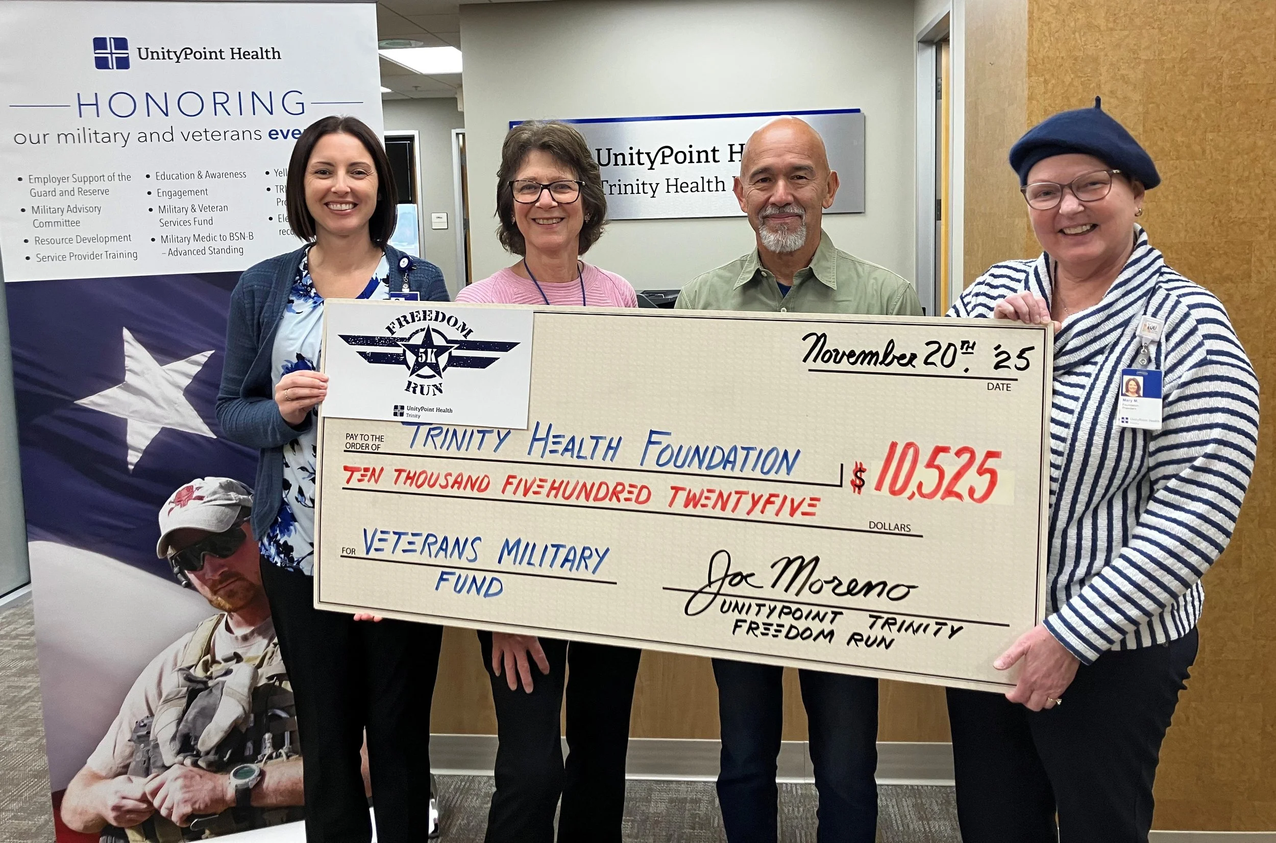 2025 check presentation - Katie Carton, Sherri, Joe Moreno, Mary Macumber.jpg