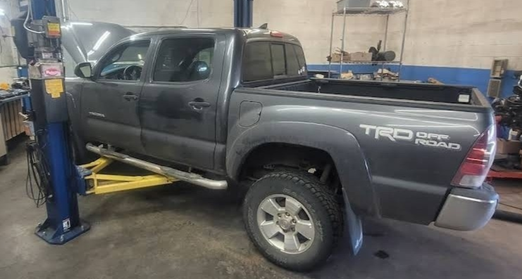 Toyota Tacoma undergoing tune-up, Lube Oil Filter & Inspection at Chucks Auto Shop Inc. in Bend Oregon work and a Transmission filter service at Chucks Auto Shop Inc. in Bend Oregon
