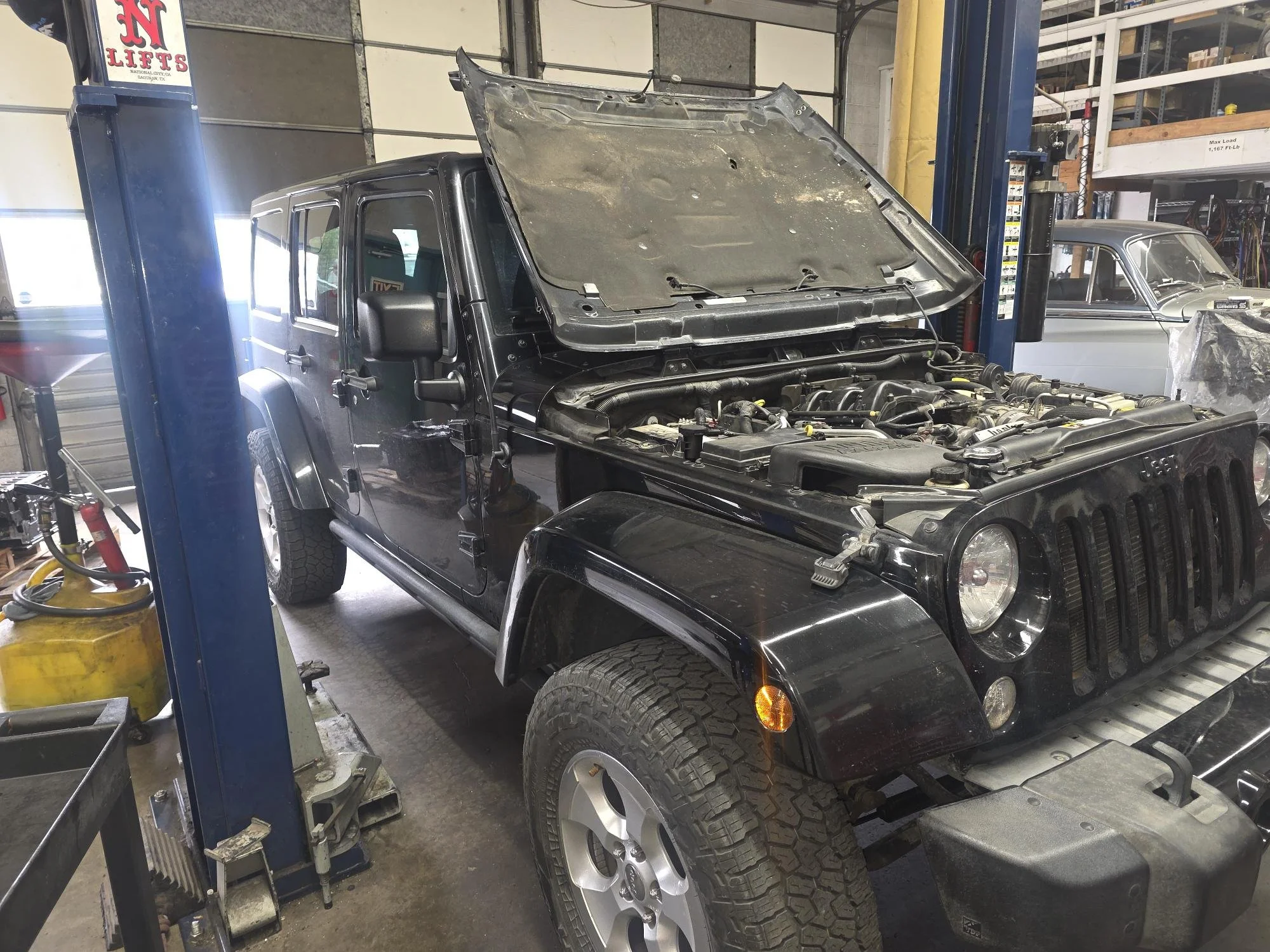 Jeep being diagnosed for a coolant leak at Chucks Auto Shop Inc. in Bend Oregon