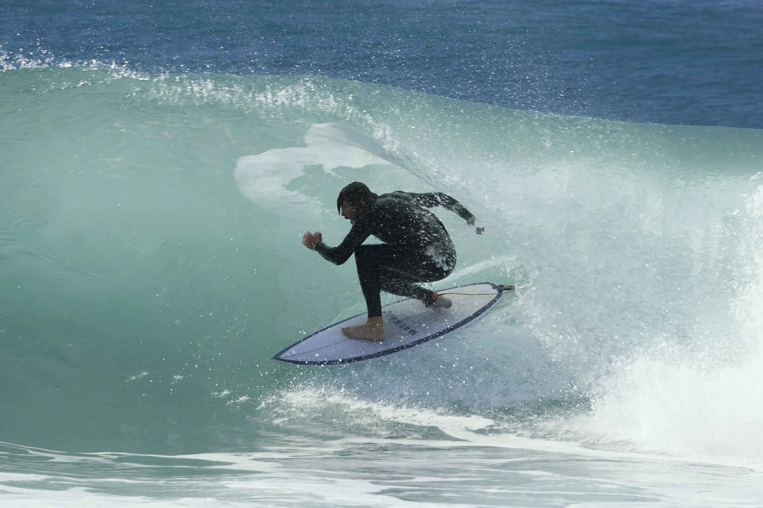 A person surfing in the "green room" at one of Australia's surf mecca's Burleigh Heads.