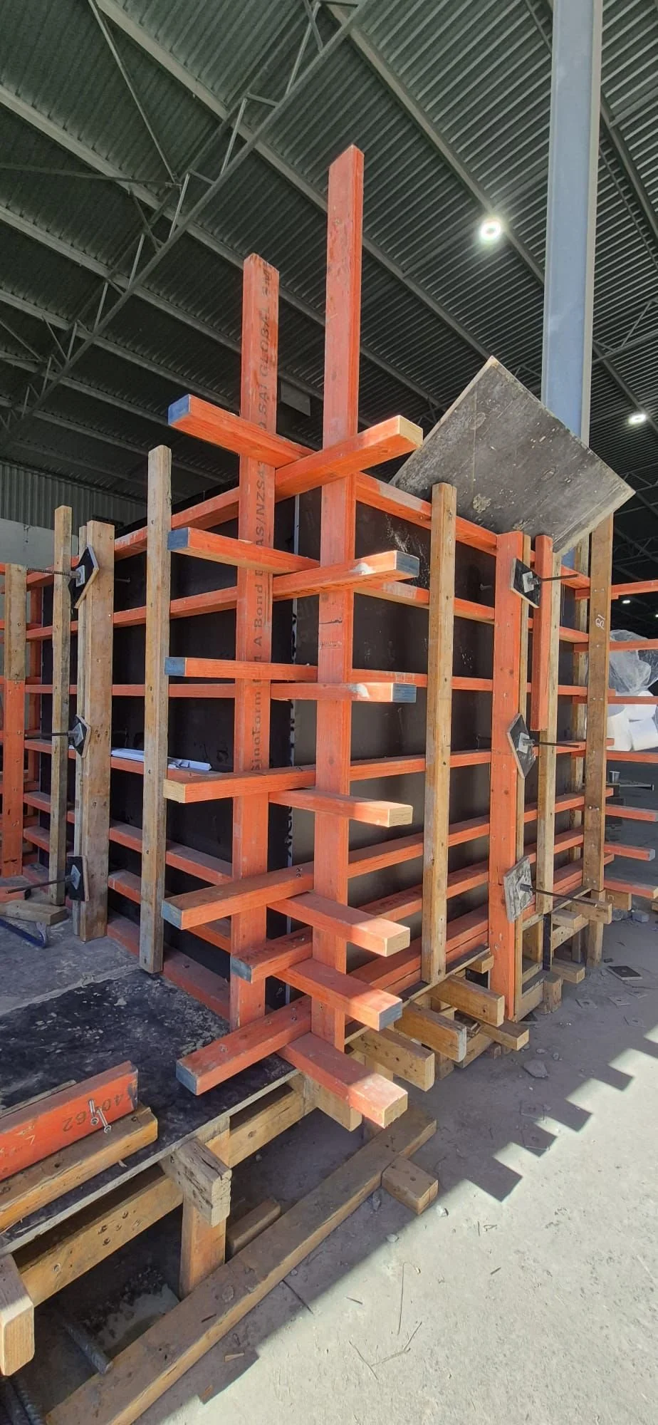 Construction site with formwork and rebar, preparing for concrete pouring.