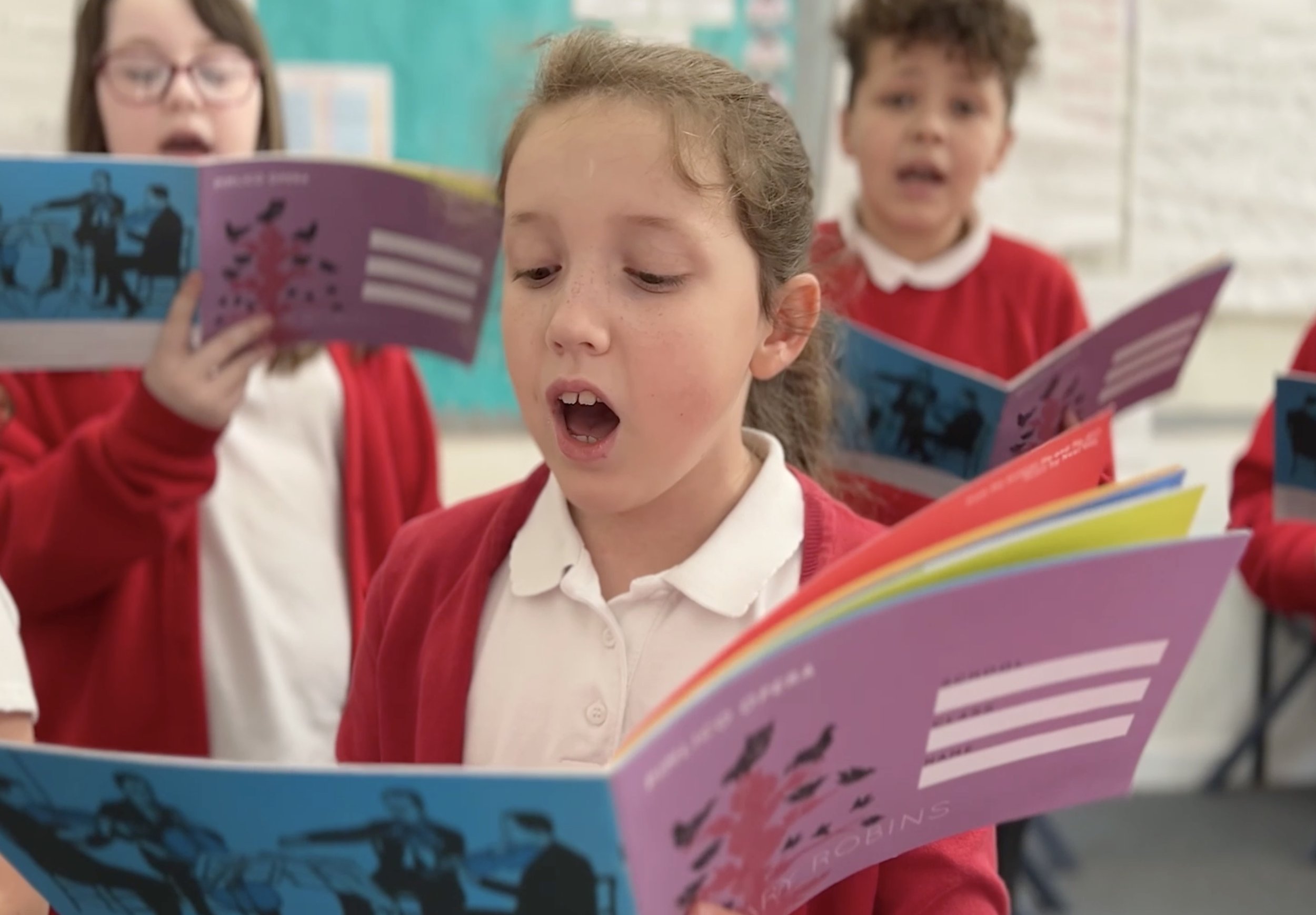 girl singing with colourful books .jpg