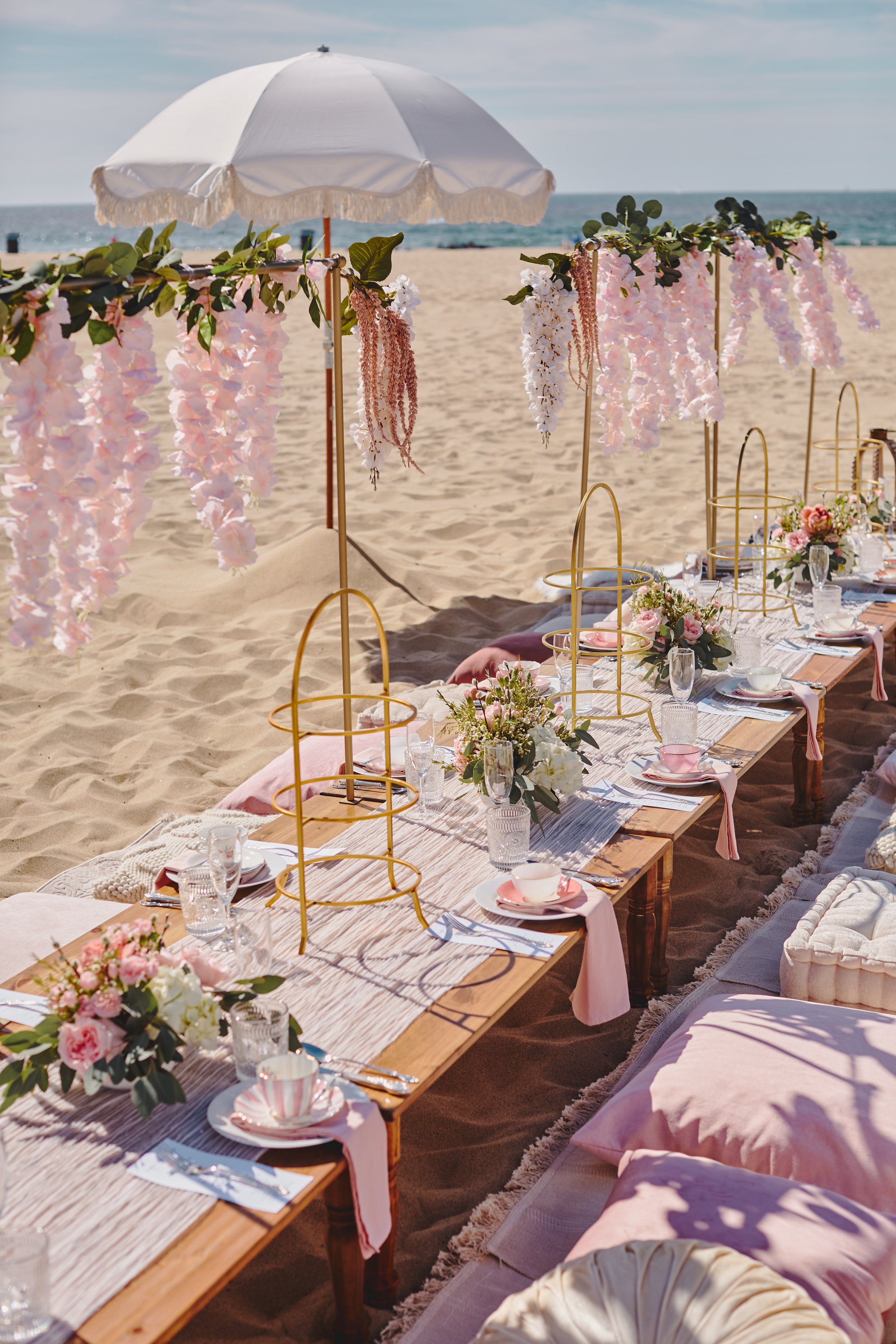 A dreamy event, picnic at the beach, engagement party.