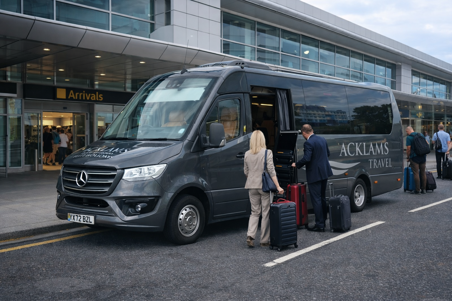 People with suitcases boarding a black Mercedes Benz shuttle bus marked 'Acklams Travel' outside an airport terminal labeled 'Arrivals'.