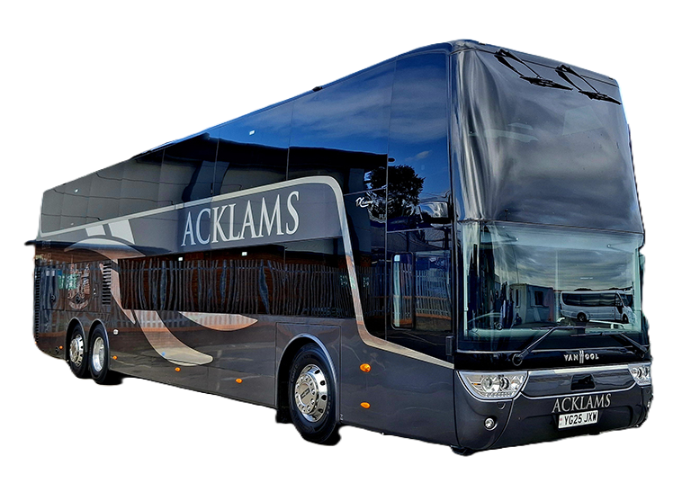 A large, shiny, black double-decker bus with the word 'ACKLAMS' on the side, parked in a lot with a building and another bus nearby.