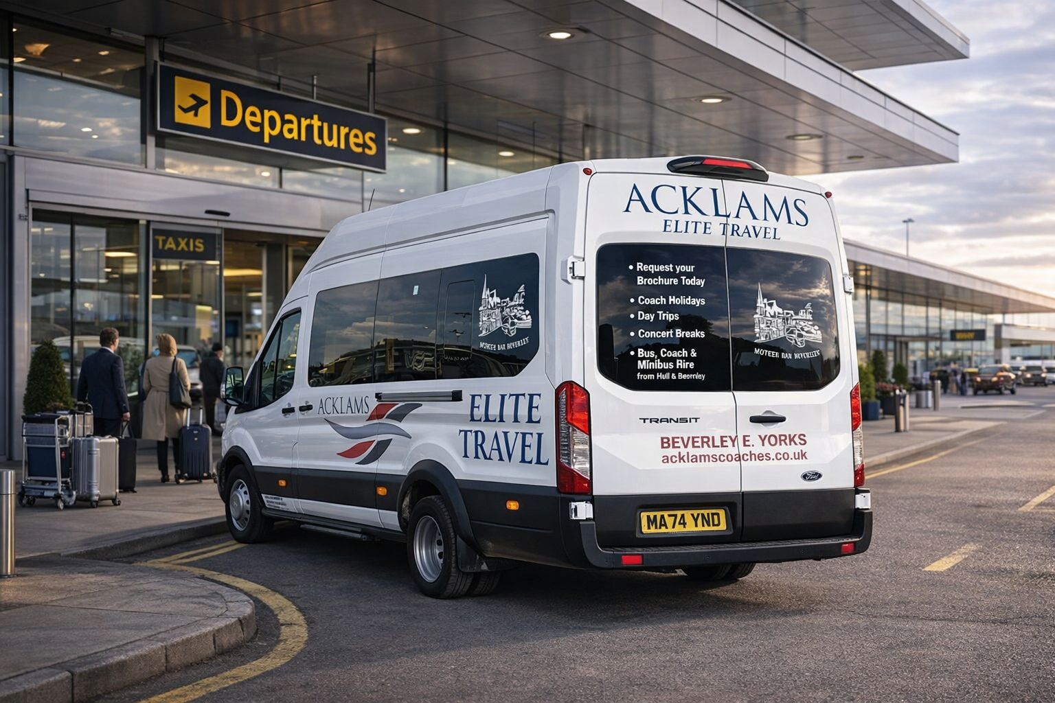 A white travel van with company branding, parked outside an airport terminal, with travelers and luggage nearby, near the departures entrance.