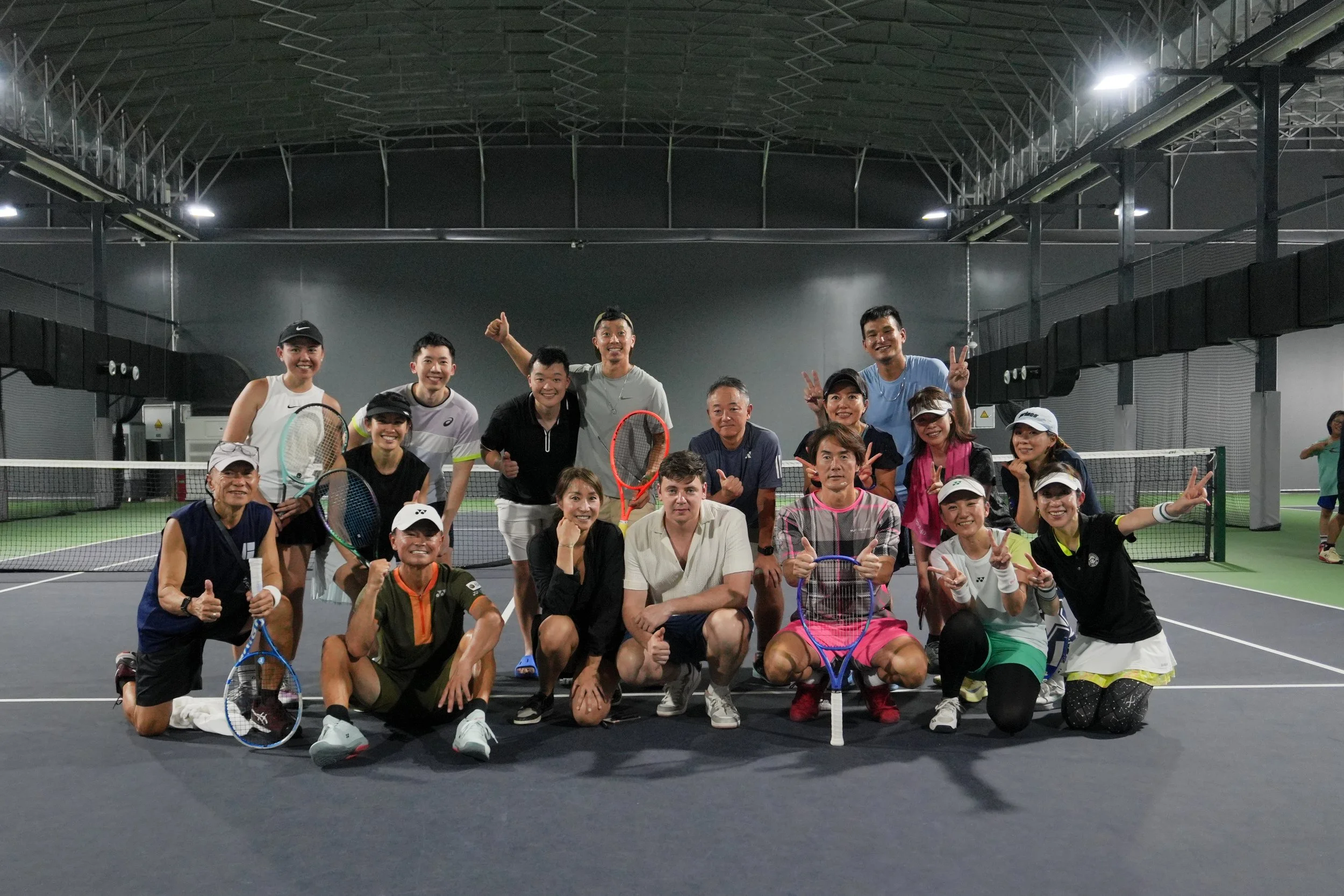 Baseline players together on court after a session
