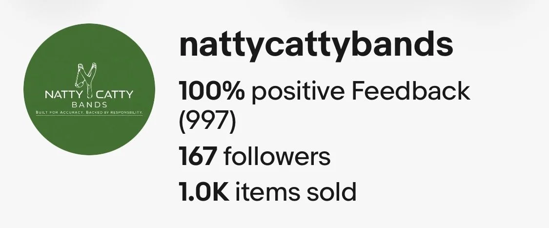 A digital graphic with a green circular logo on the left that has a white drawing of a finger pointing upwards and text that says "NATTY CATTY BANDS" with the slogan "BUILT FOR ACCURACY. BACKED BY RESPONSIBILITY." Below the logo, the graphic displays the social media handle "nattycattybands" and achievement stats: "100% positive Feedback (997)," "167 followers," and "1.0K items sold" in bold black text.