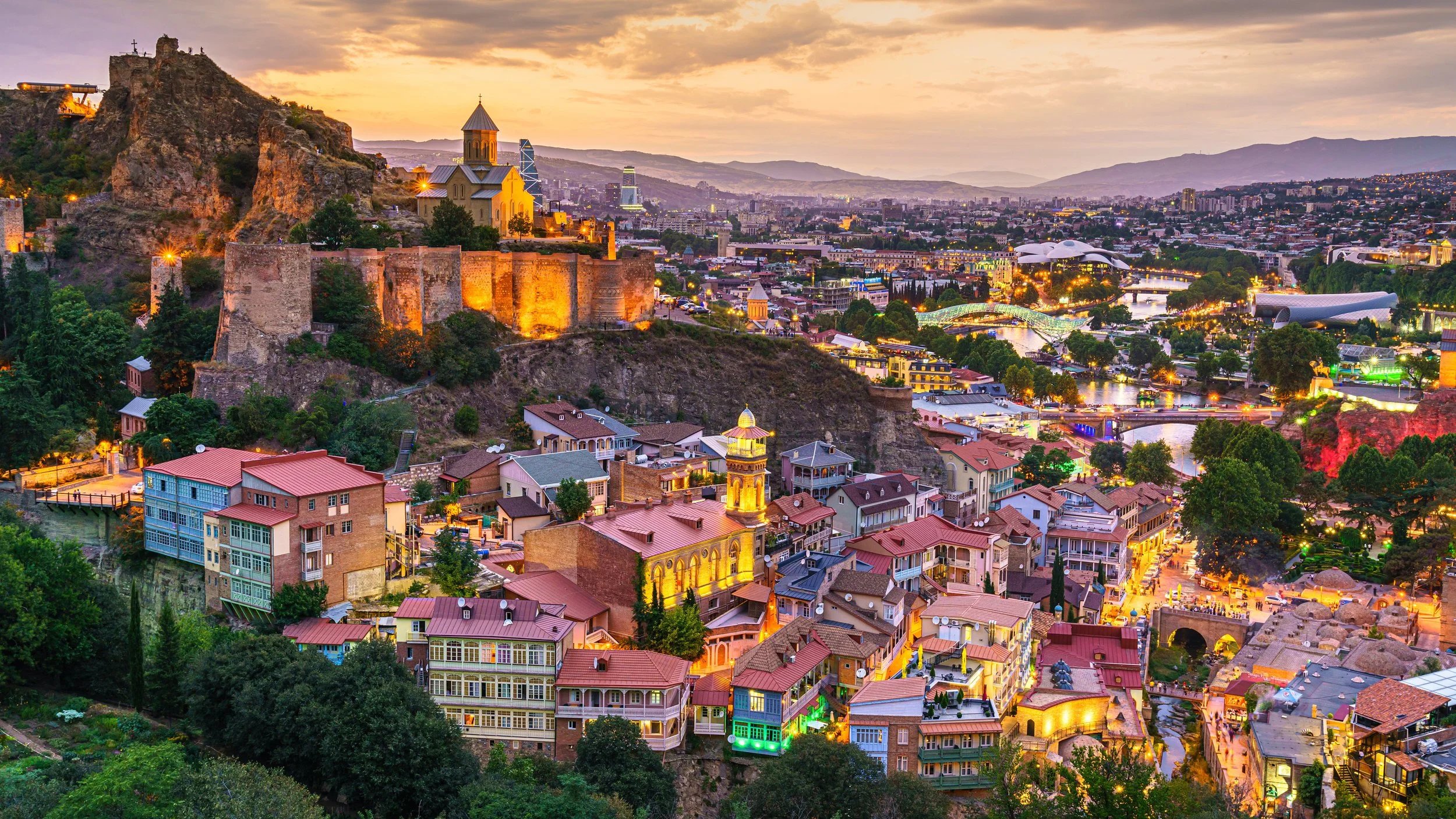 Colorful Old Tbilisi houses and narrow streets with views of Narikala Fortress in Georgia, popular Caucasus travel destination