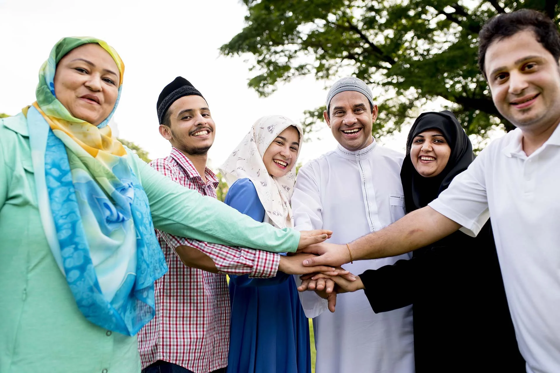 muslim-group-of-friends-stacking-hands-2026-01-07-23-24-24-utc.jpg
