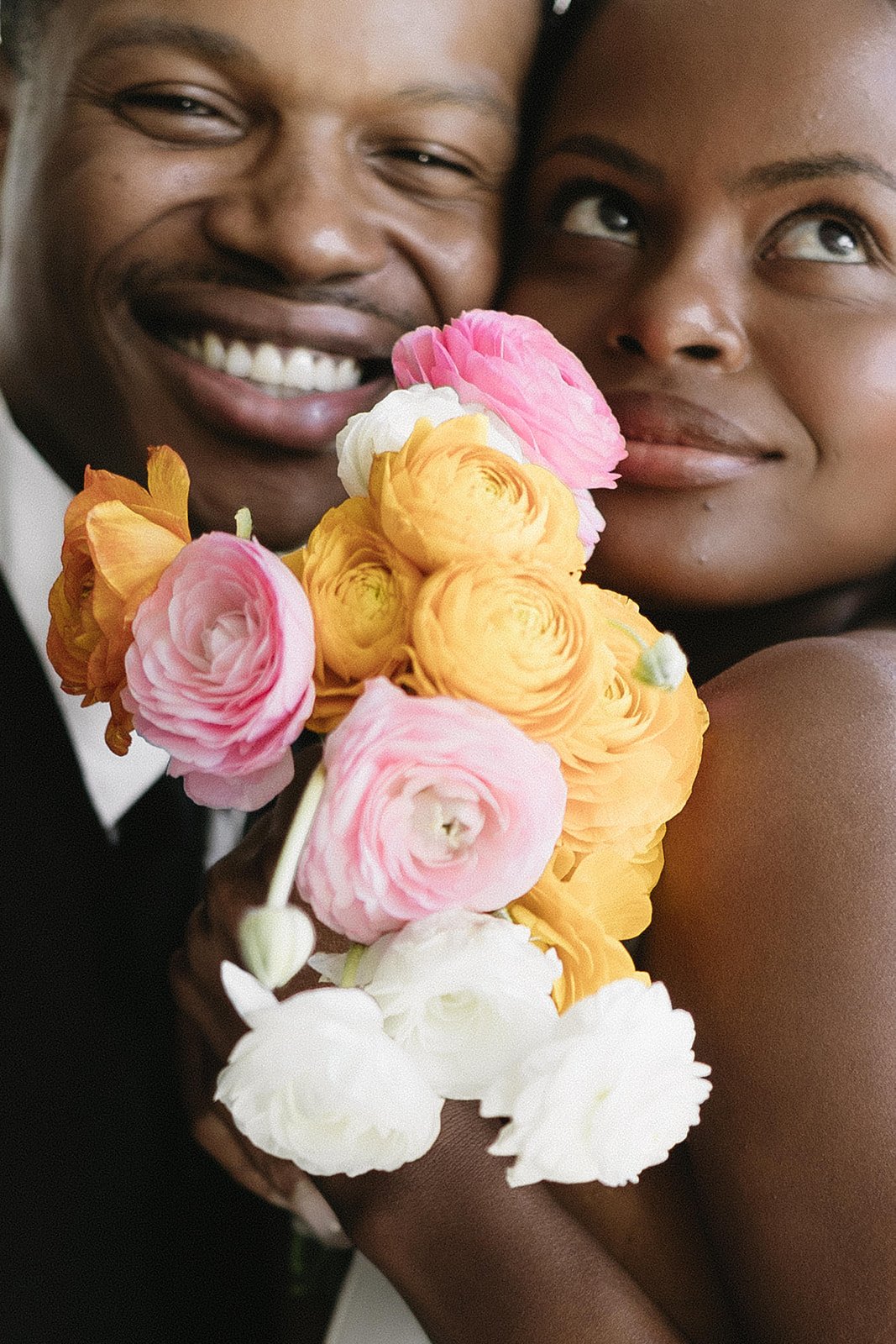 2 people posing with spring floral smiling and happy couple