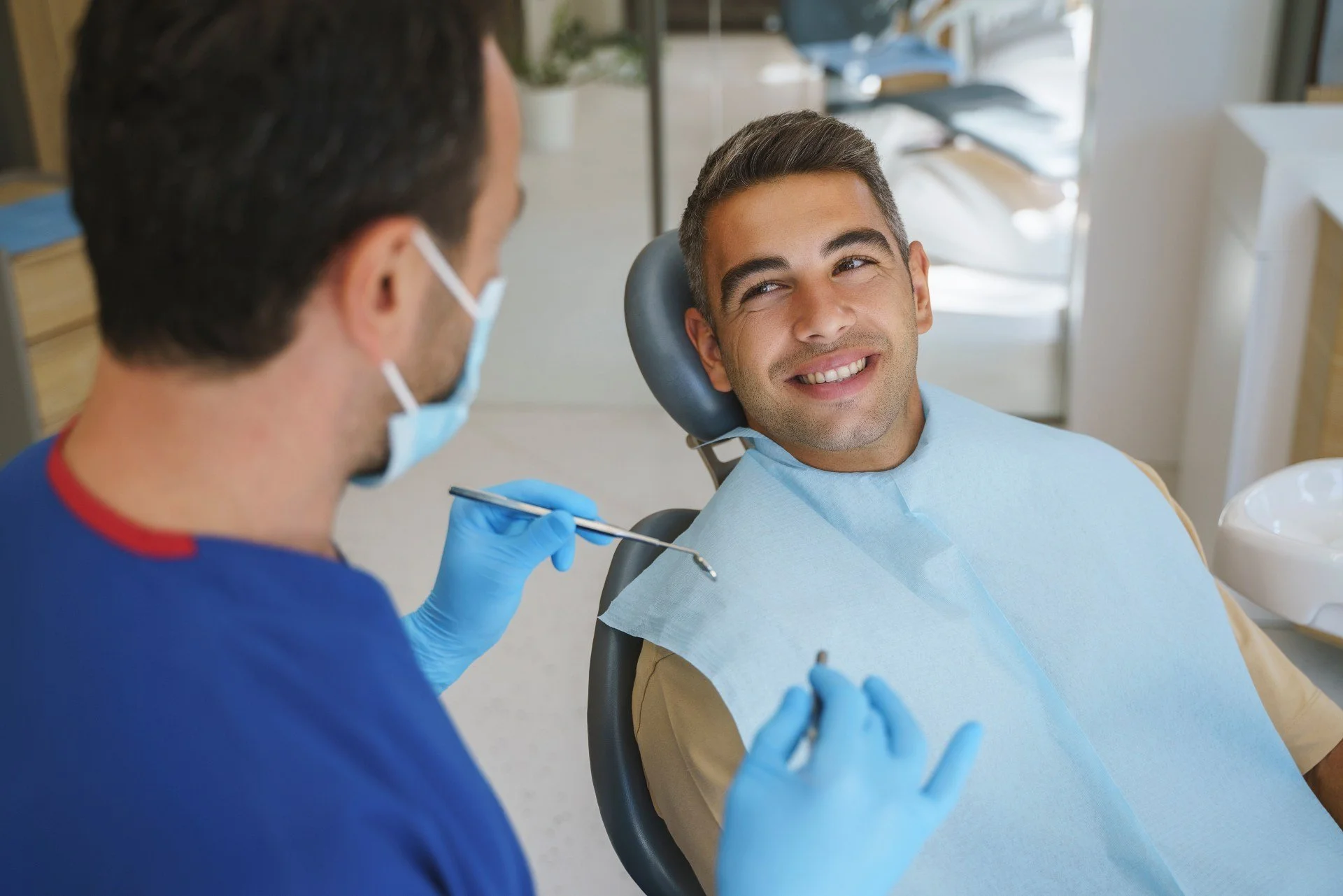 Patient relaxed in dental chair during consultation for dental implant or sinus lift treatment