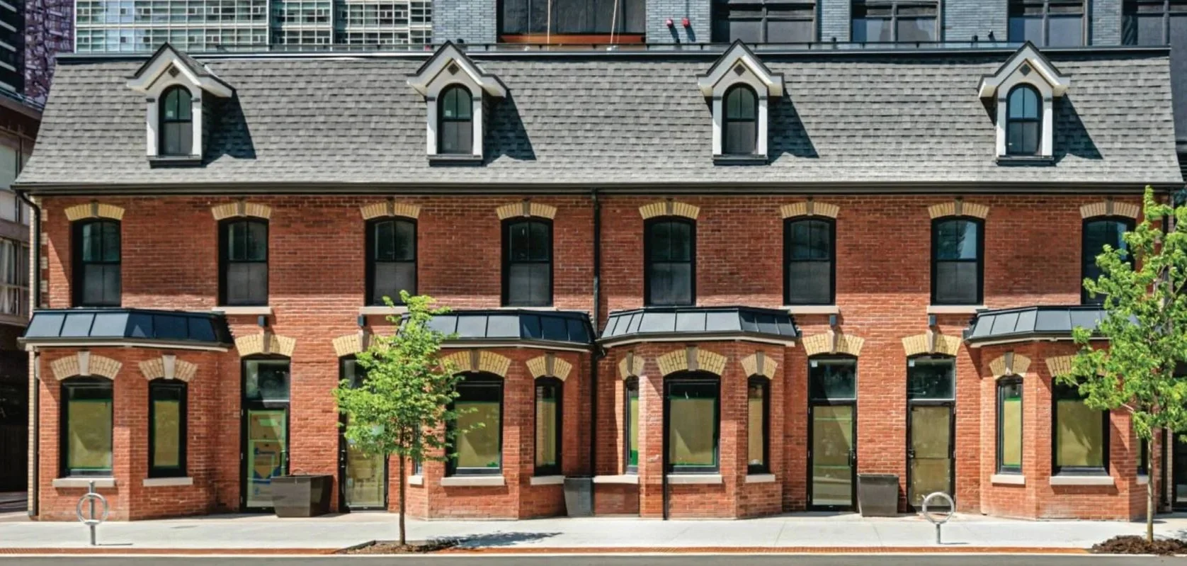 The 1876 Thomas Bryce Row heritage facade at 16 Wellesley Street West, downtown Toronto, where Innova Dental opens in March 2027.