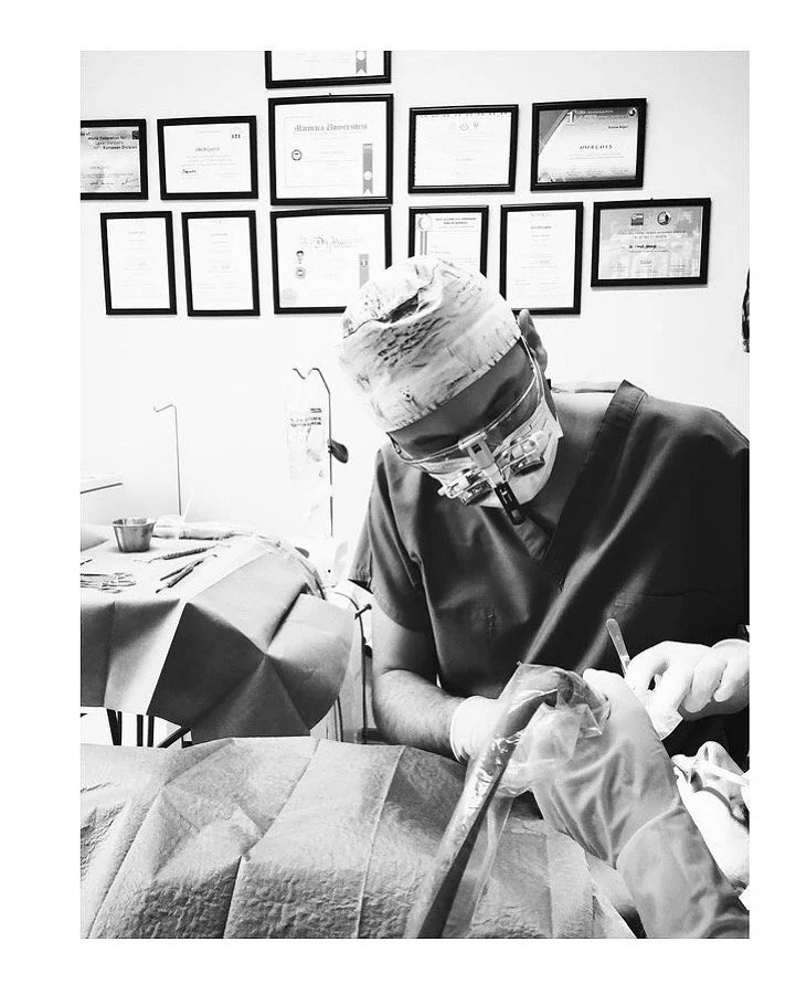 Dr. Onur Cavus providing a dental surgical procedure utilizing aseptic surgical technique
