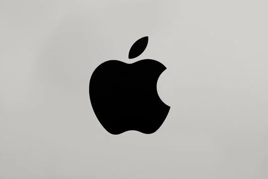 Black Apple logo on a light gray background.