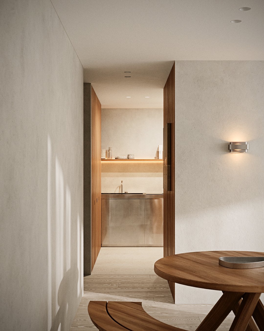 Interieur met zichtlijn door leefruimte, combinatie van eiken parket en natuursteen en warme afwerking.