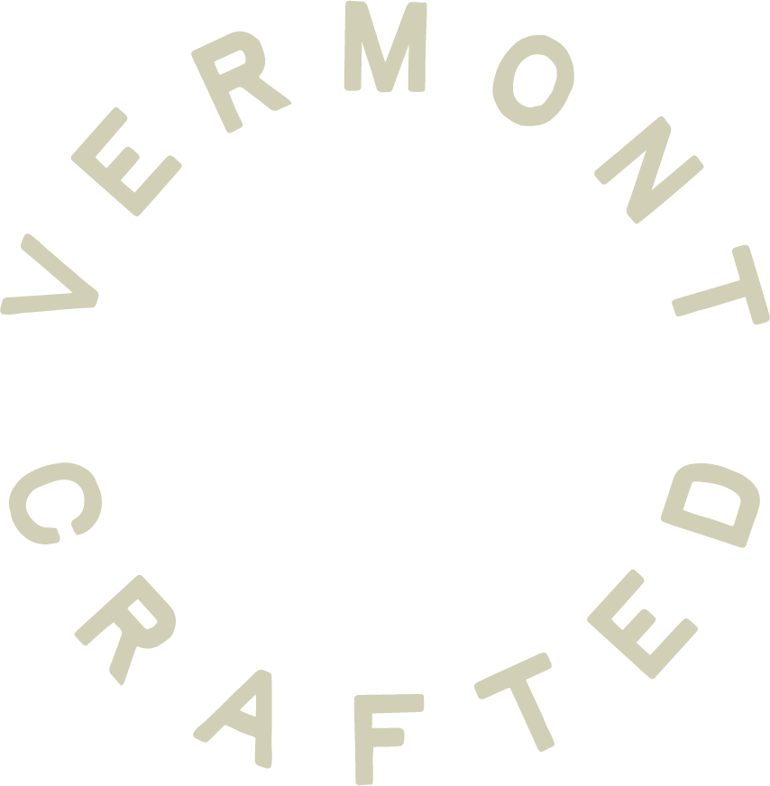 The image shows a circular logo with the words "Vermont Crafted" arranged around the circle.
