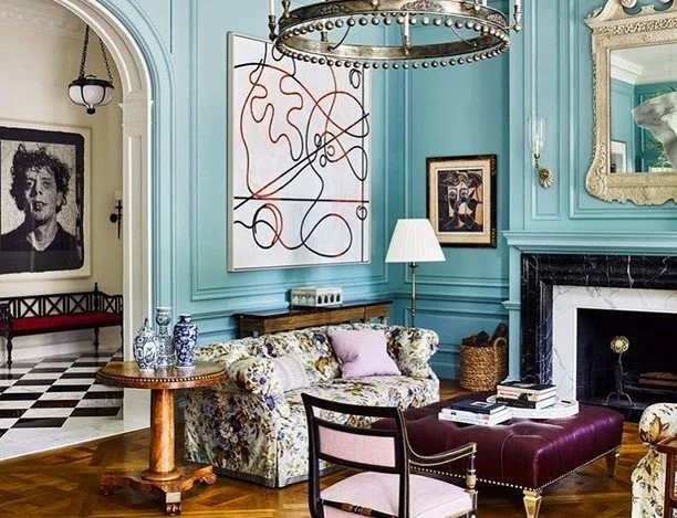 Georgian living room with a bright turquoise paint, an eclectic mix of traditional furniture and modern artwork