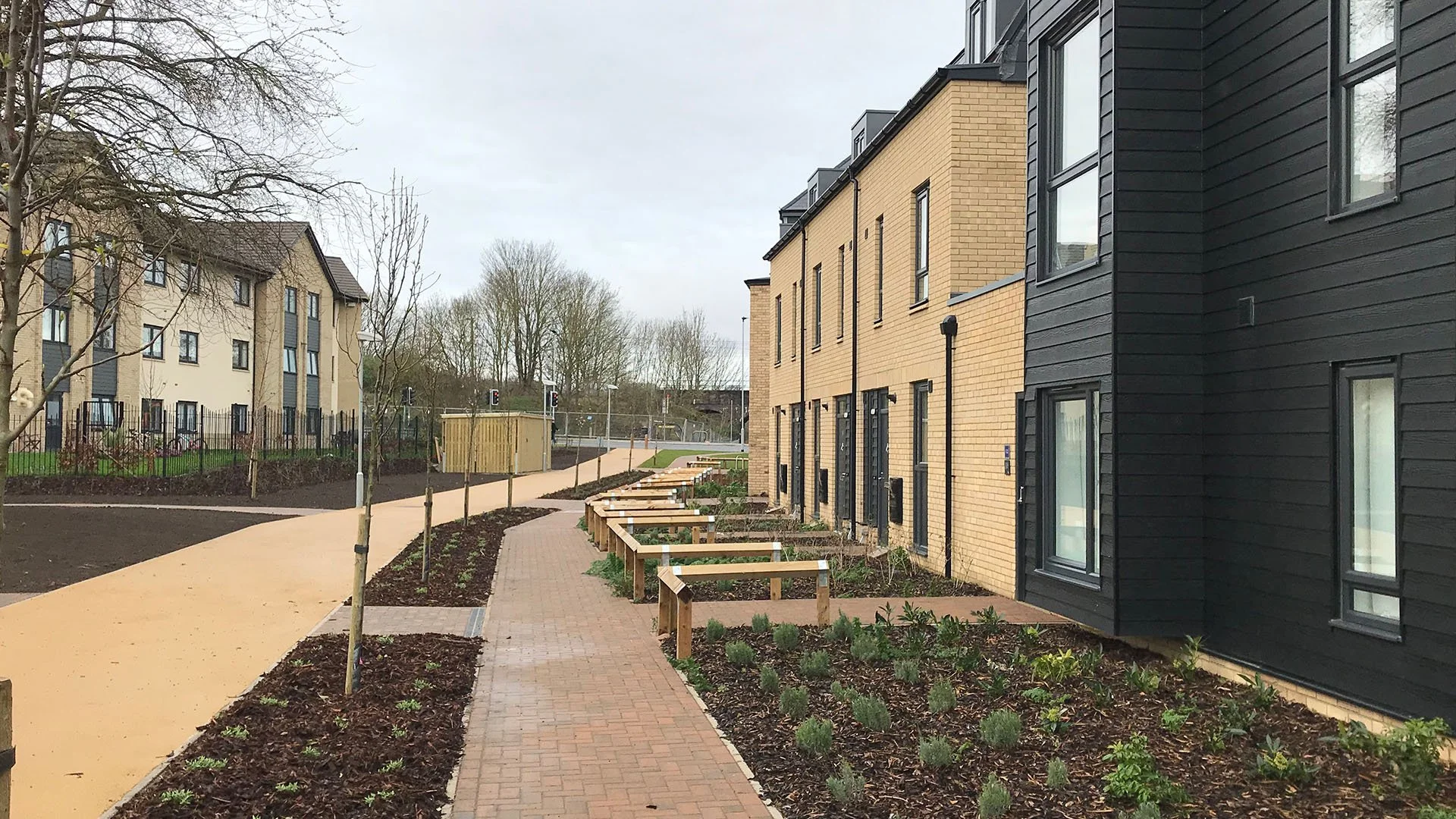 Completed homes and landscaped pedestrian route at Drovers Place