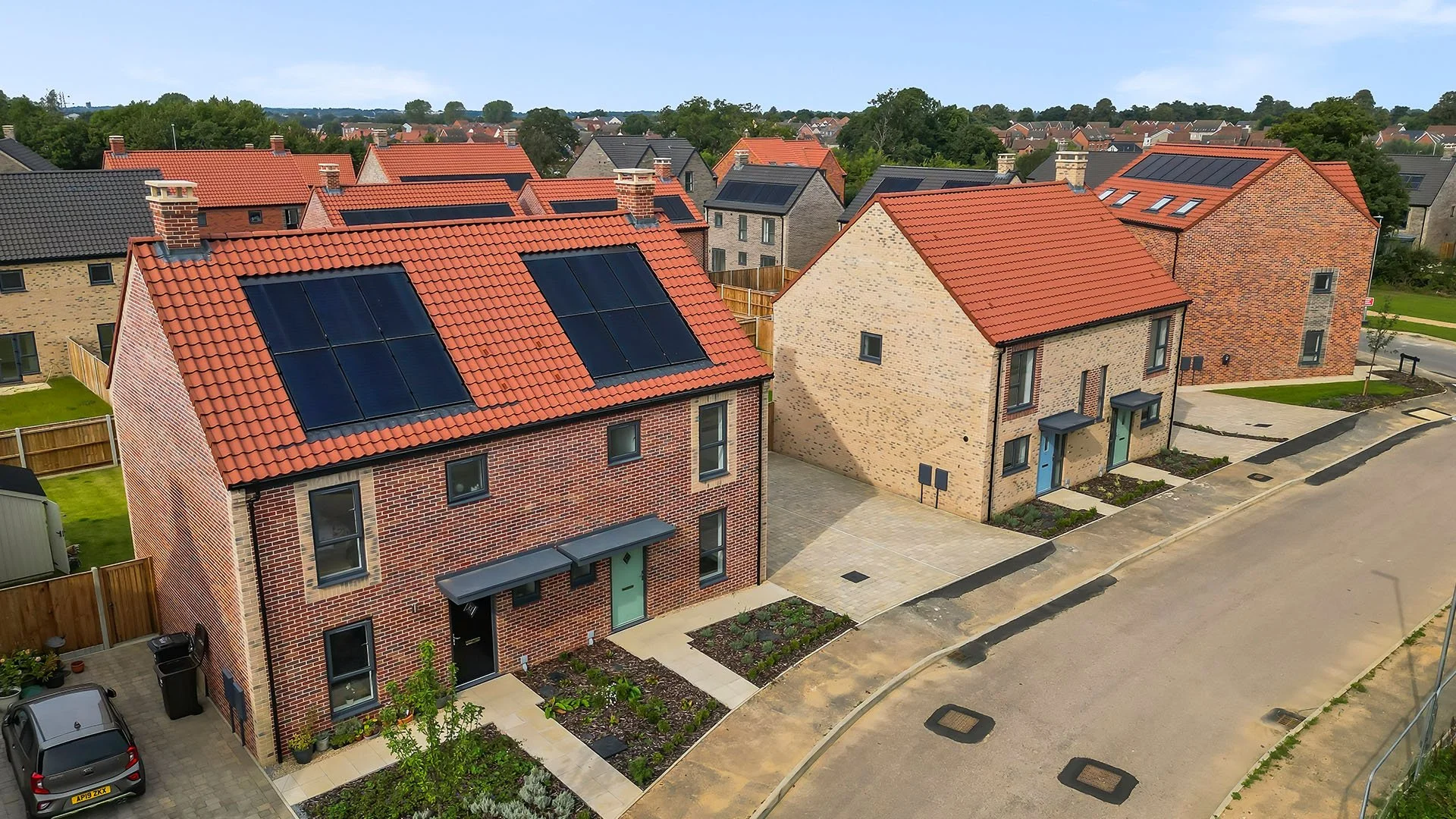 Aerial view of homes with rooftop solar panels at St. Giles Park