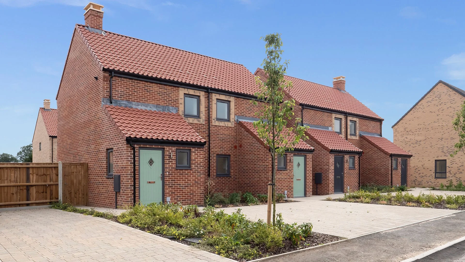 Red-brick homes and garages at St. Giles Park
