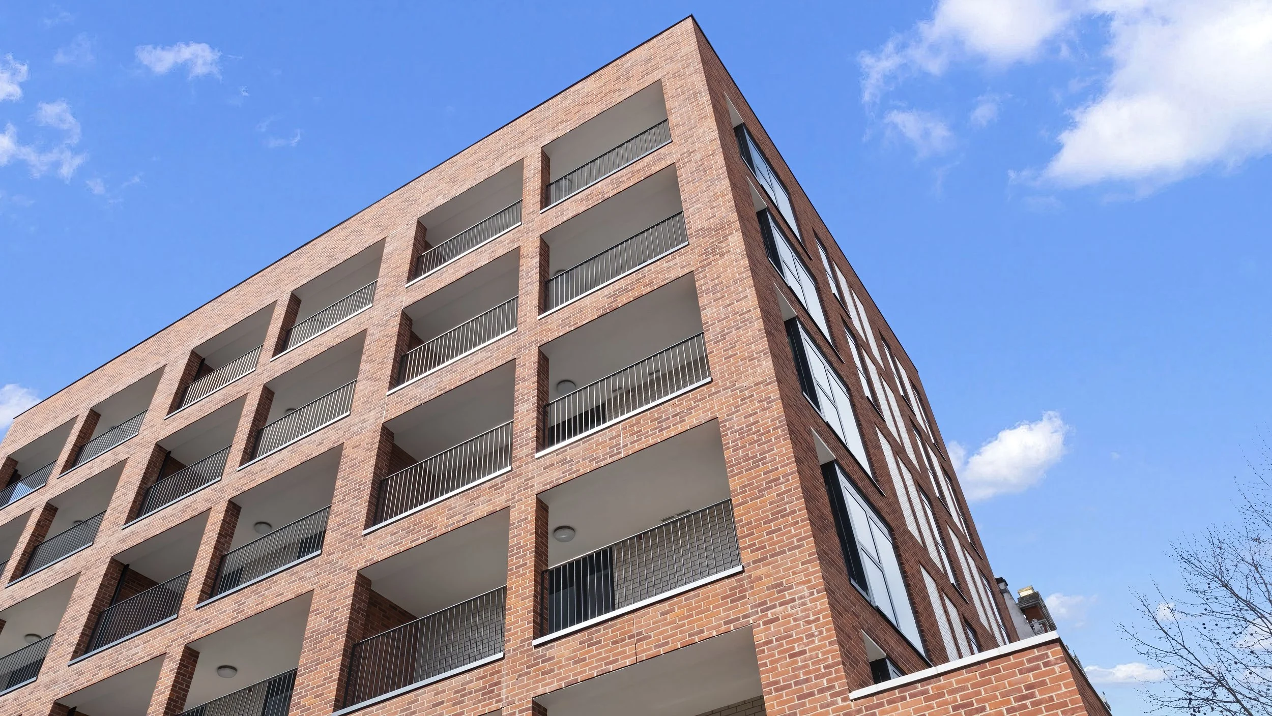Balconies on the red-brick Ivy Church Lane apartments