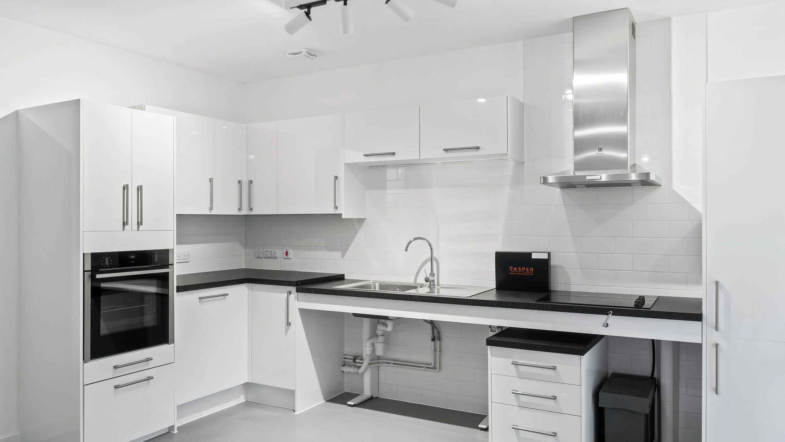 Modern white fitted kitchen at Ivy Church Lane