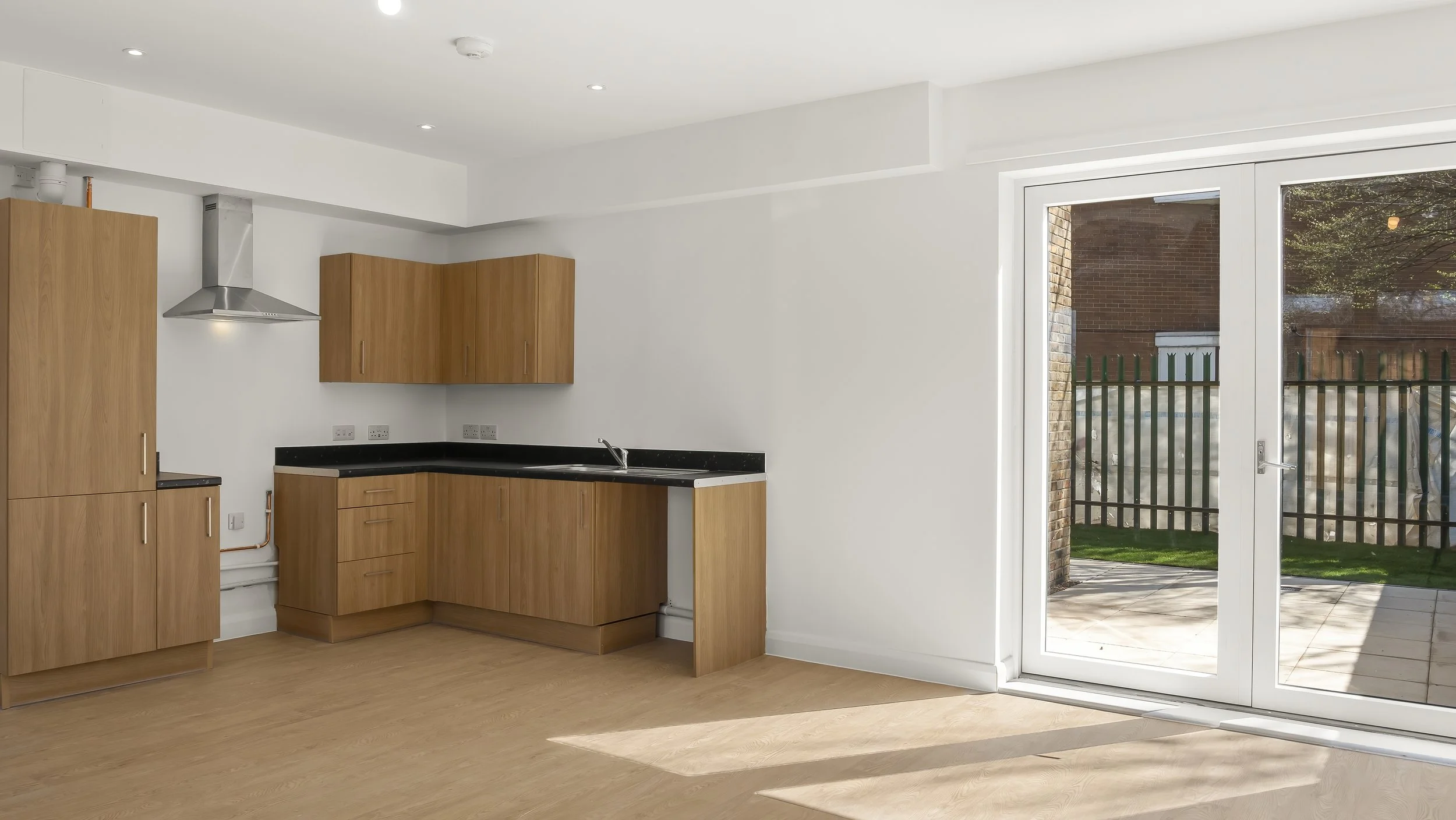 Open-plan kitchen and patio doors inside Loxford Hall