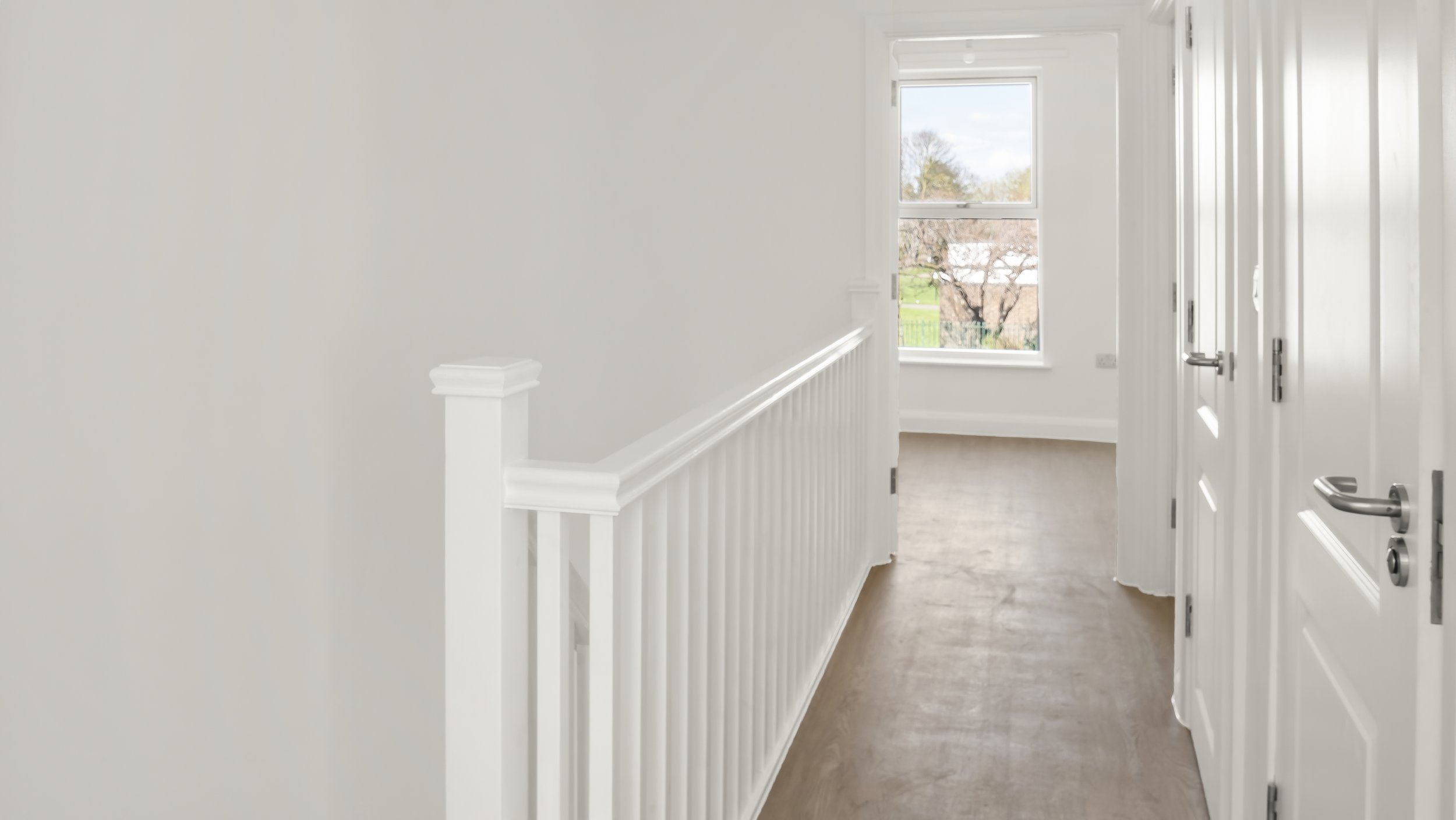 Light-filled landing and corridor at Loxford Hall