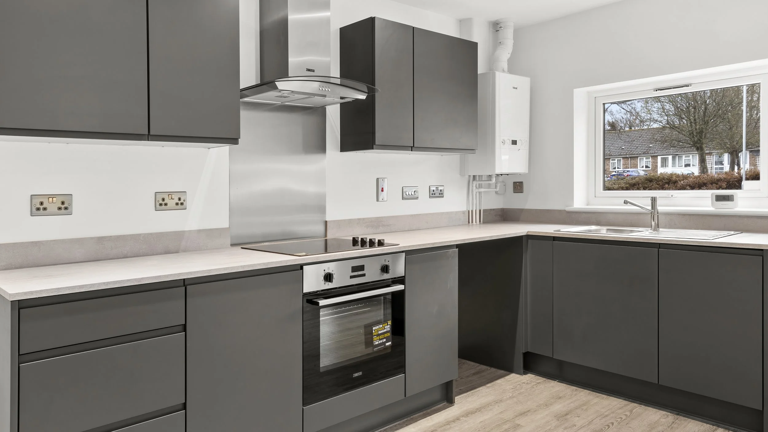 Fitted kitchen with integrated appliances at Wamil Court