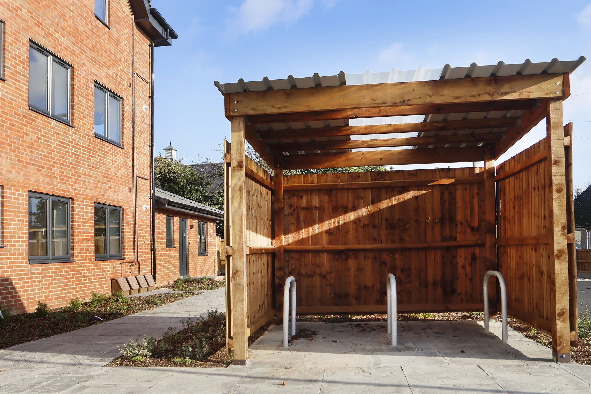 Timber cycle store beside Wade House