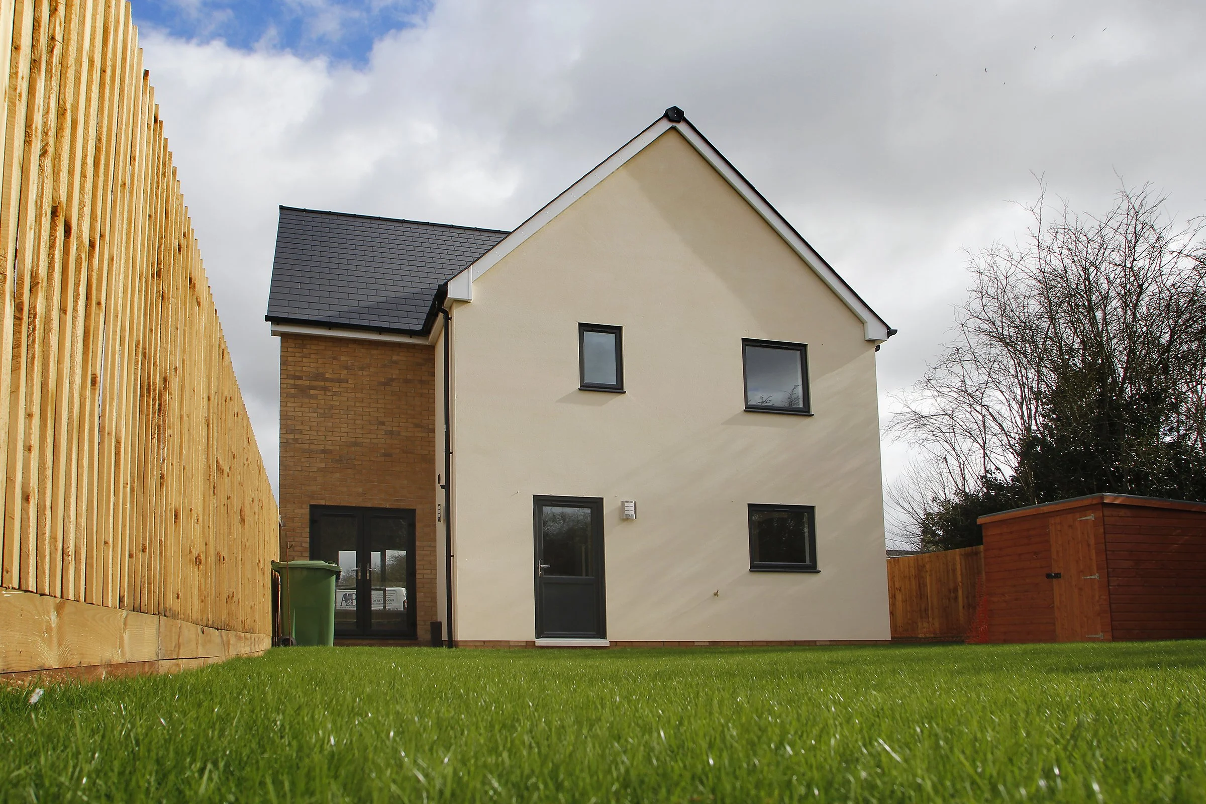 Rear garden and two-storey home at Needingworth