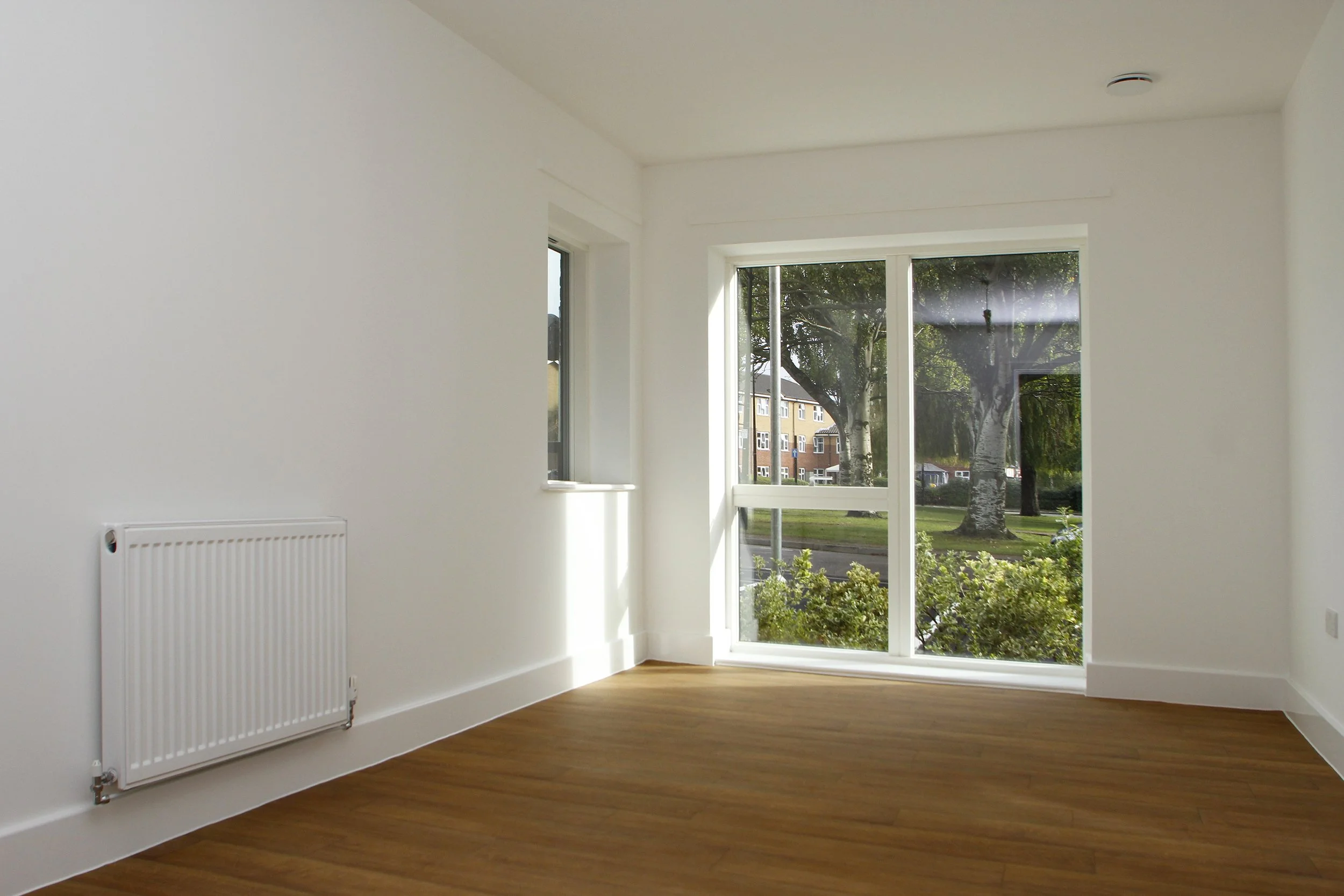 Bright living room with glazed doors to the garden at Antler House