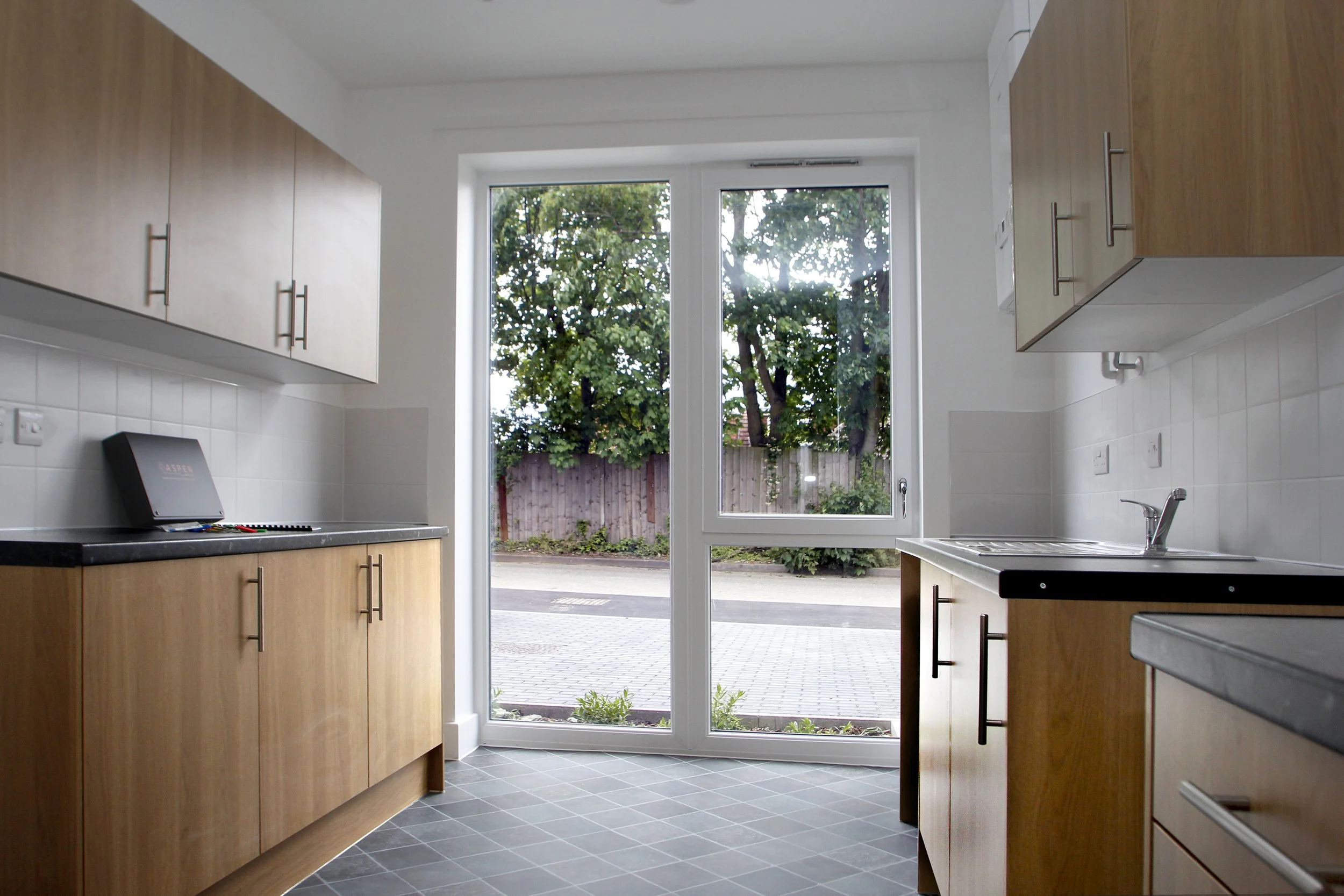 Fitted kitchen with glazed doors at Wessex Close