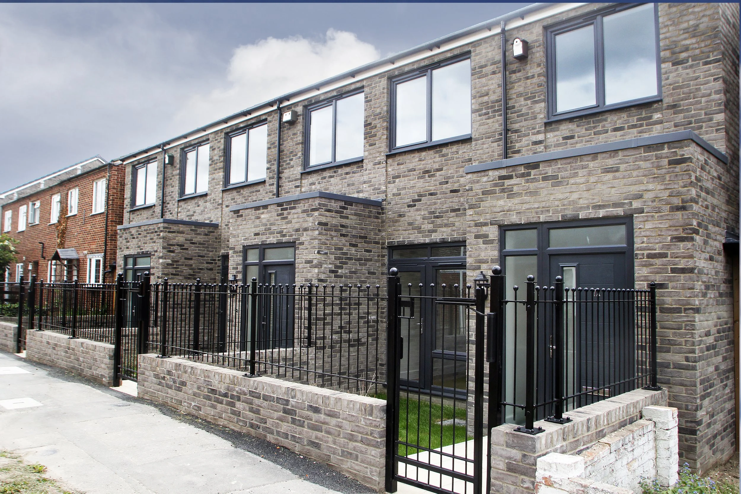 Terraced homes and landscaped frontage at Wessex Close