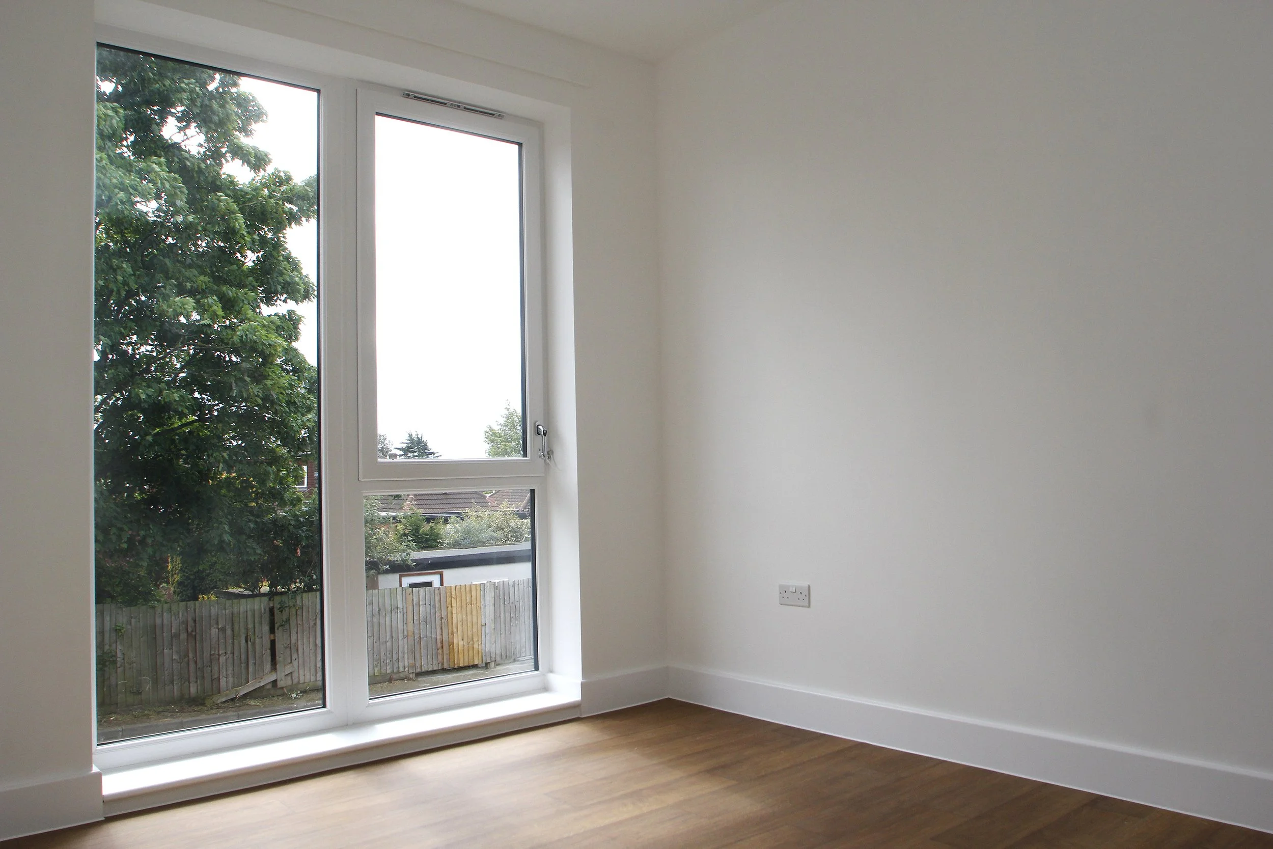Living room with full-height window at Wessex Close