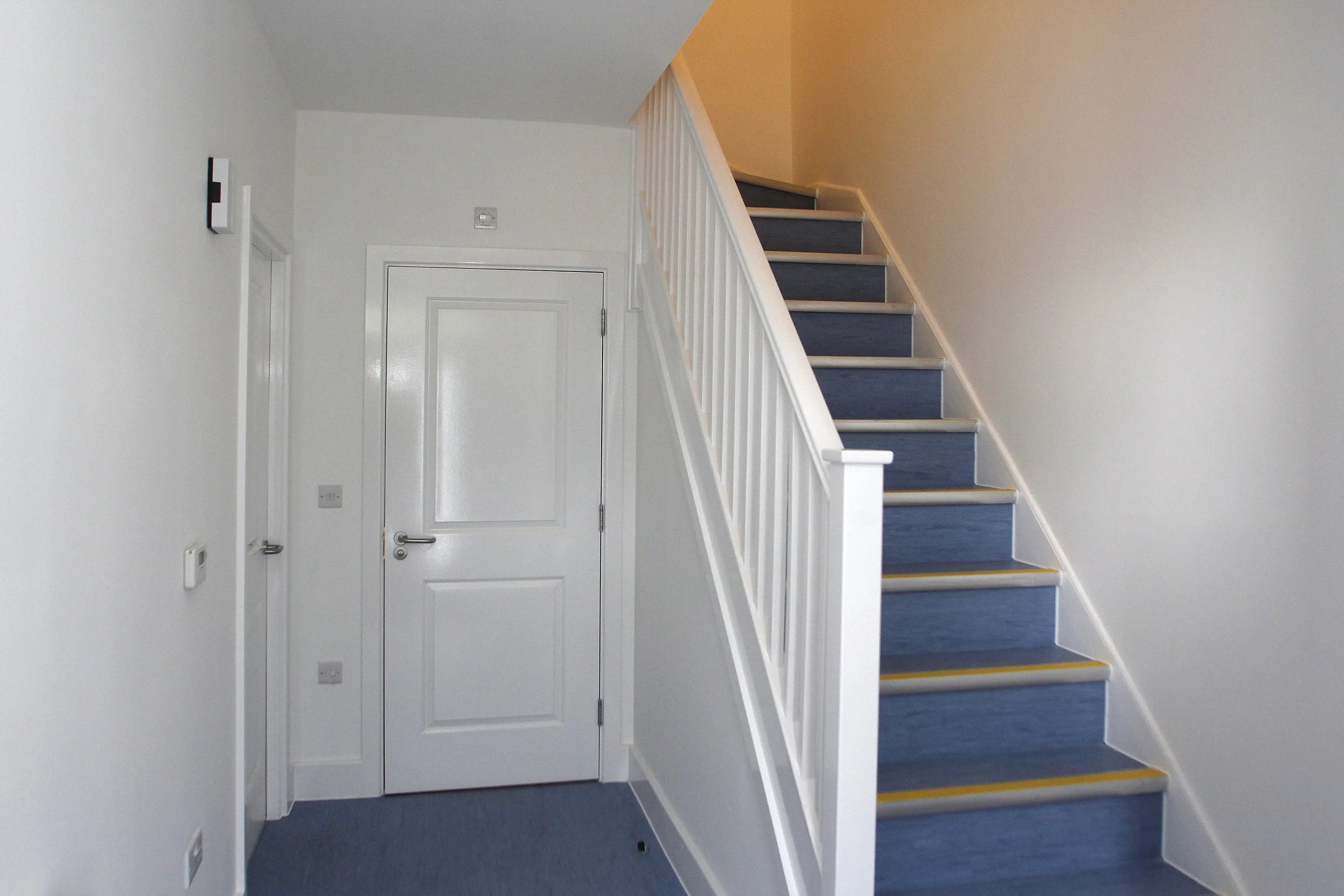 Entrance hall and staircase inside a Wessex Close home