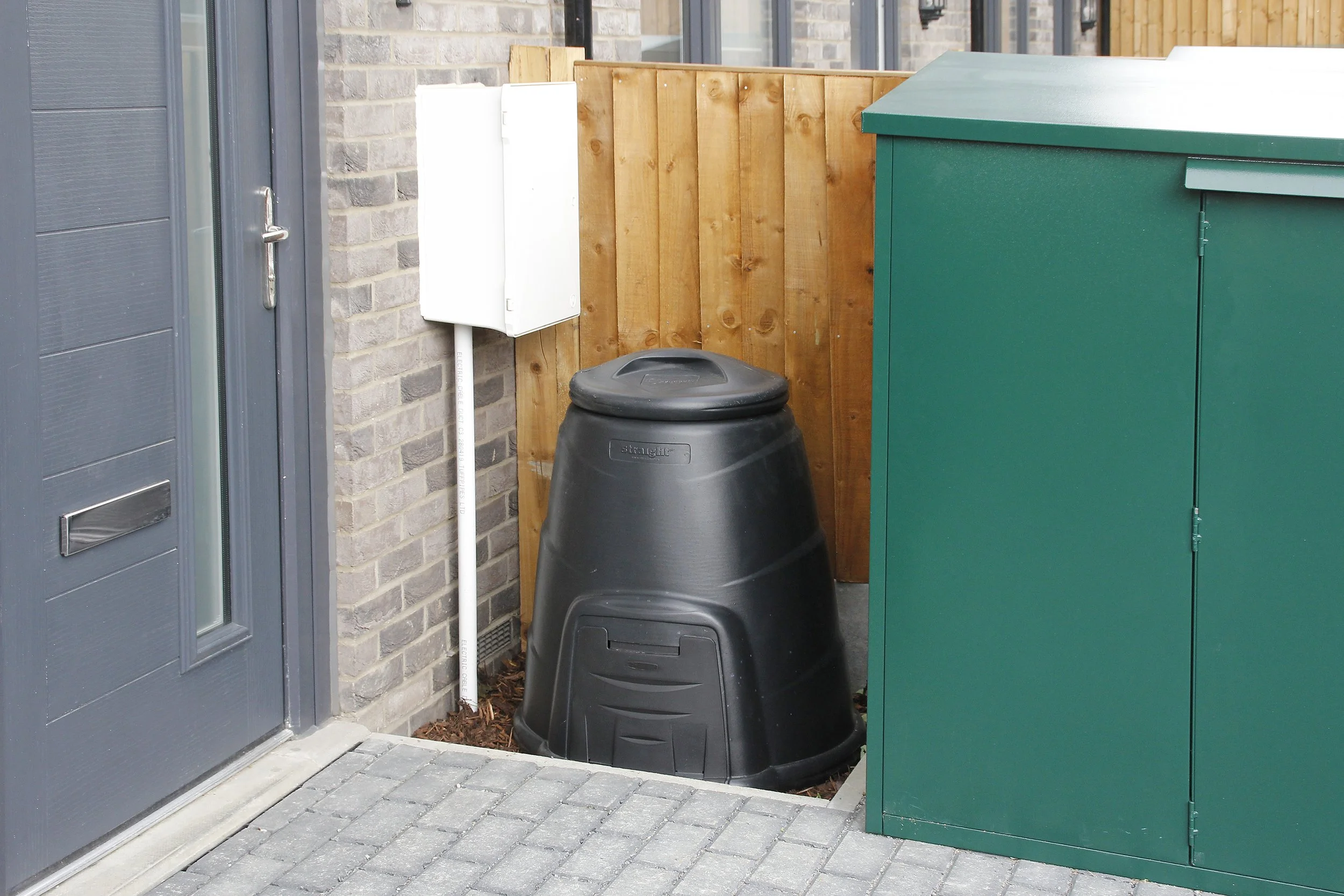 Screened bin storage beside the homes at Wessex Close